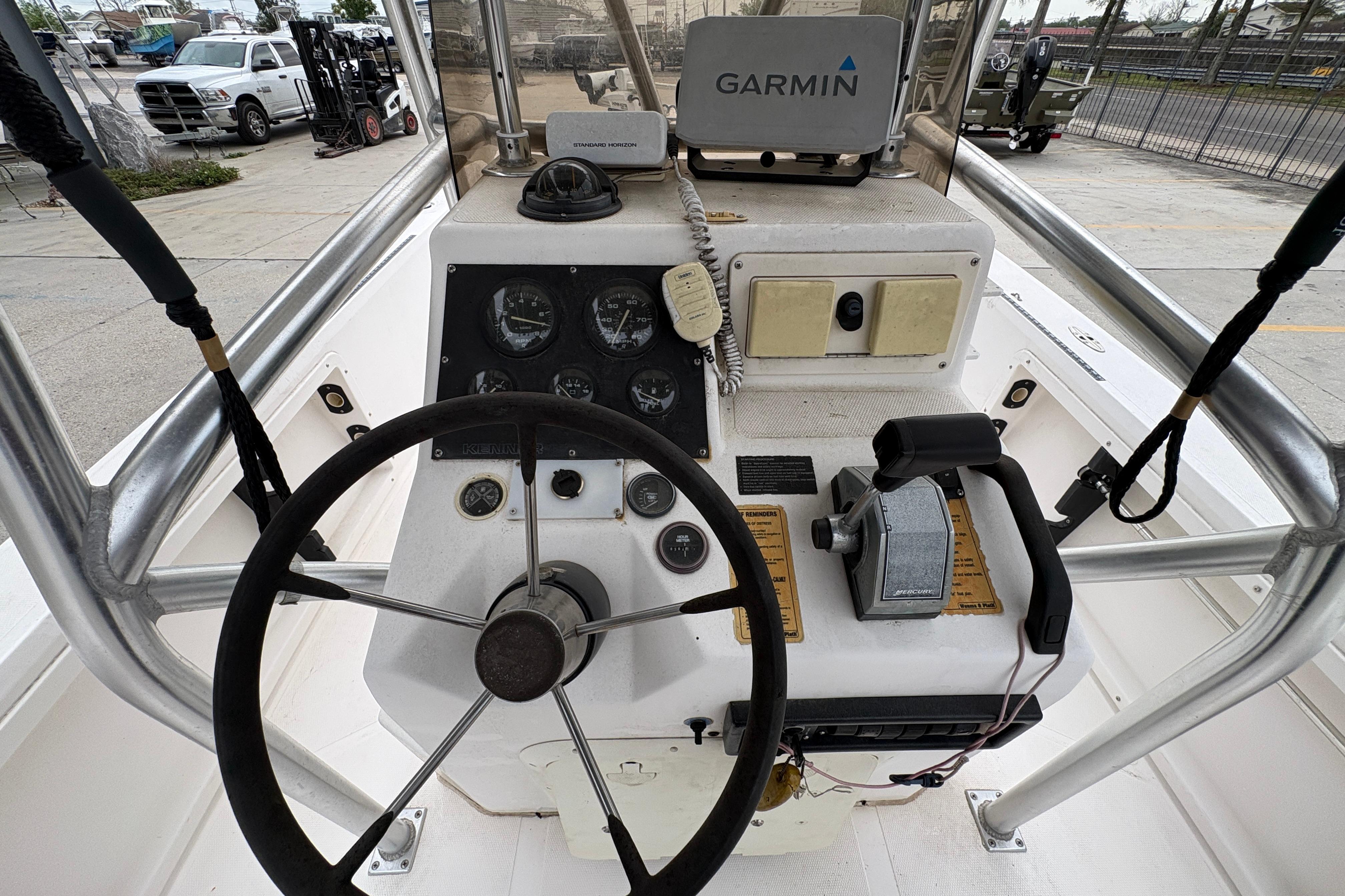 Cockpit of a 2000 Kenner 21 VISION boat with Garmin navigation system.