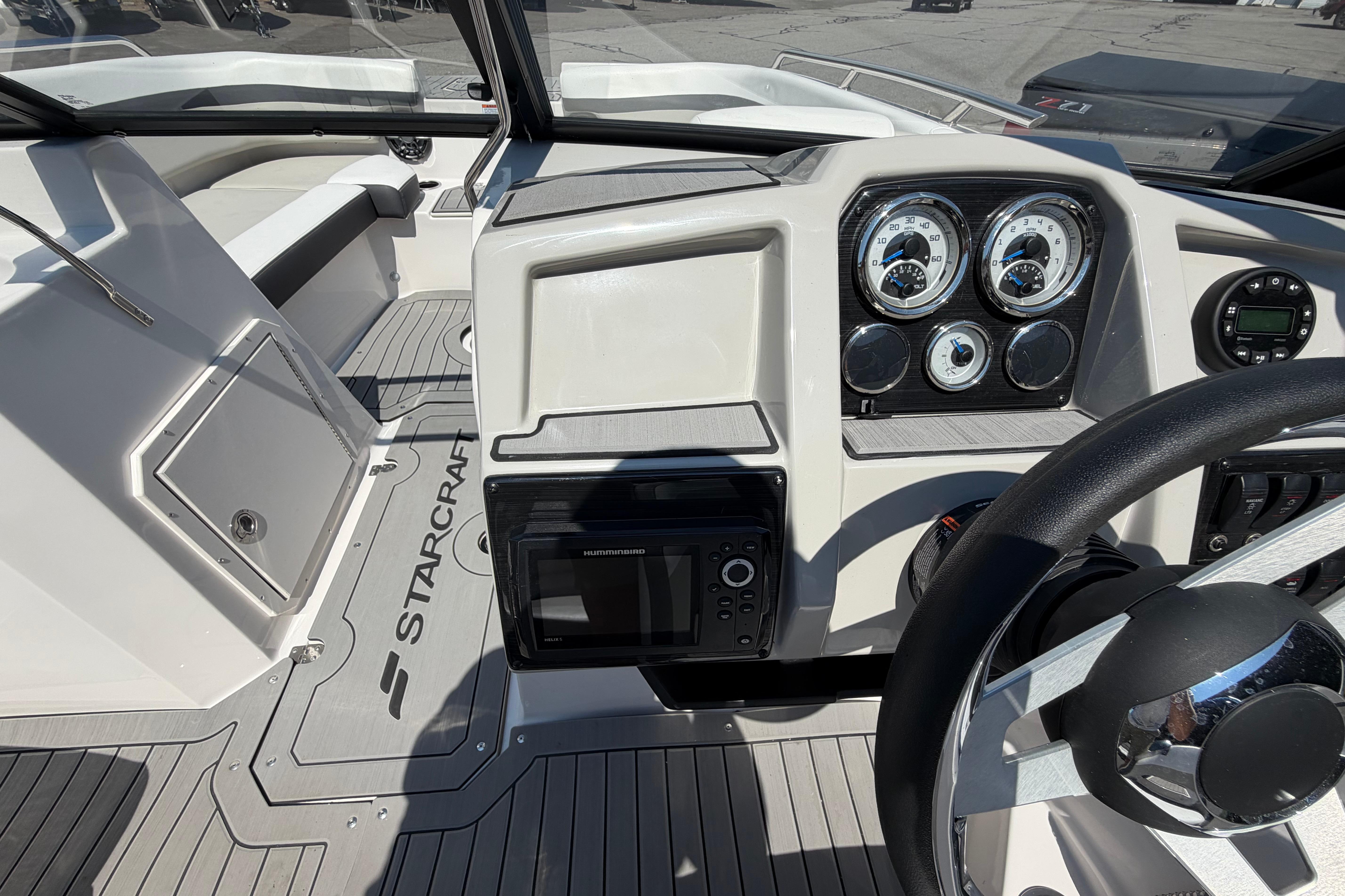 2025 Starcraft SVX 190 OB boat dashboard with gauges and steering wheel.
