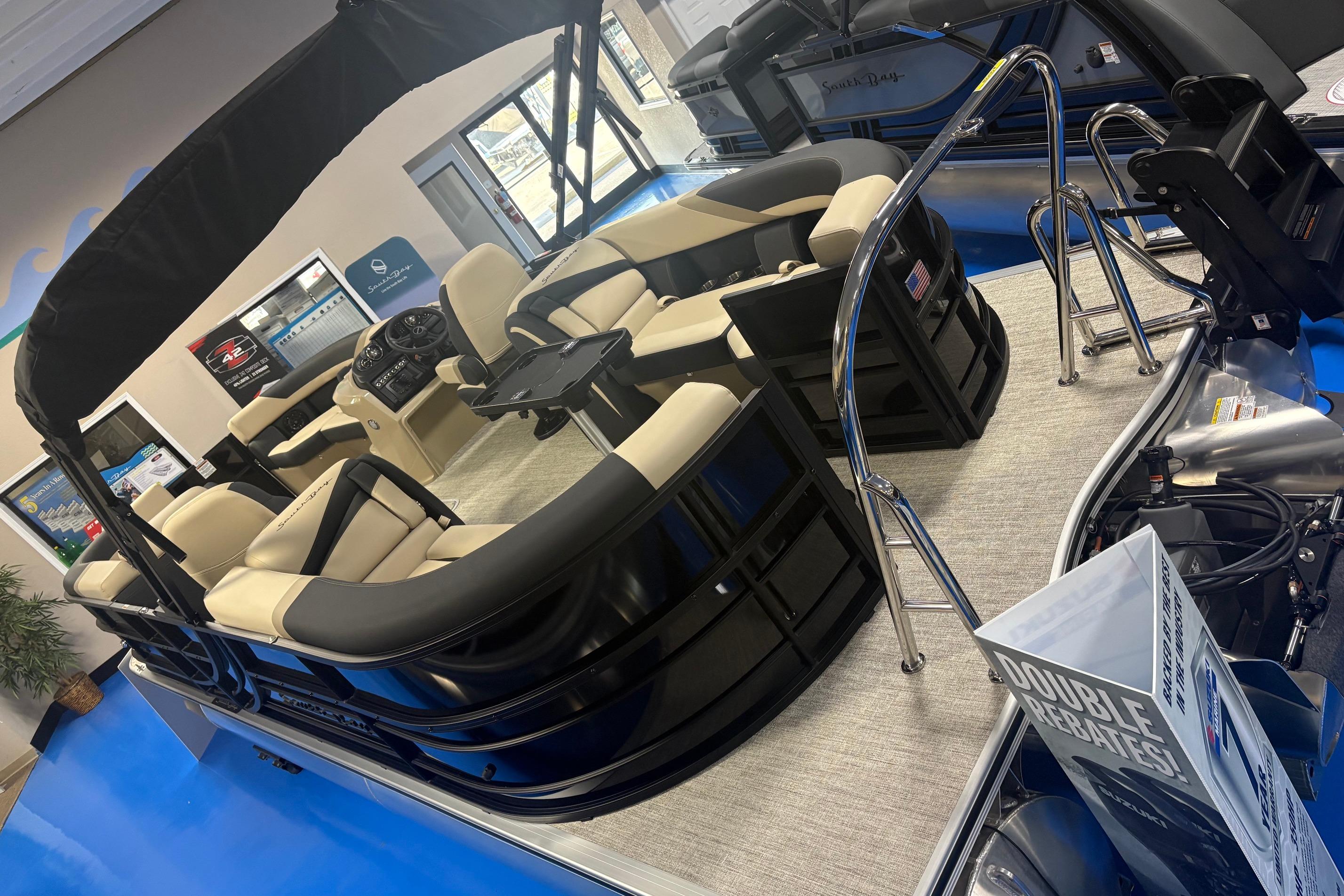 2026 South Bay S224RS pontoon boat with beige seating and modern interior design.