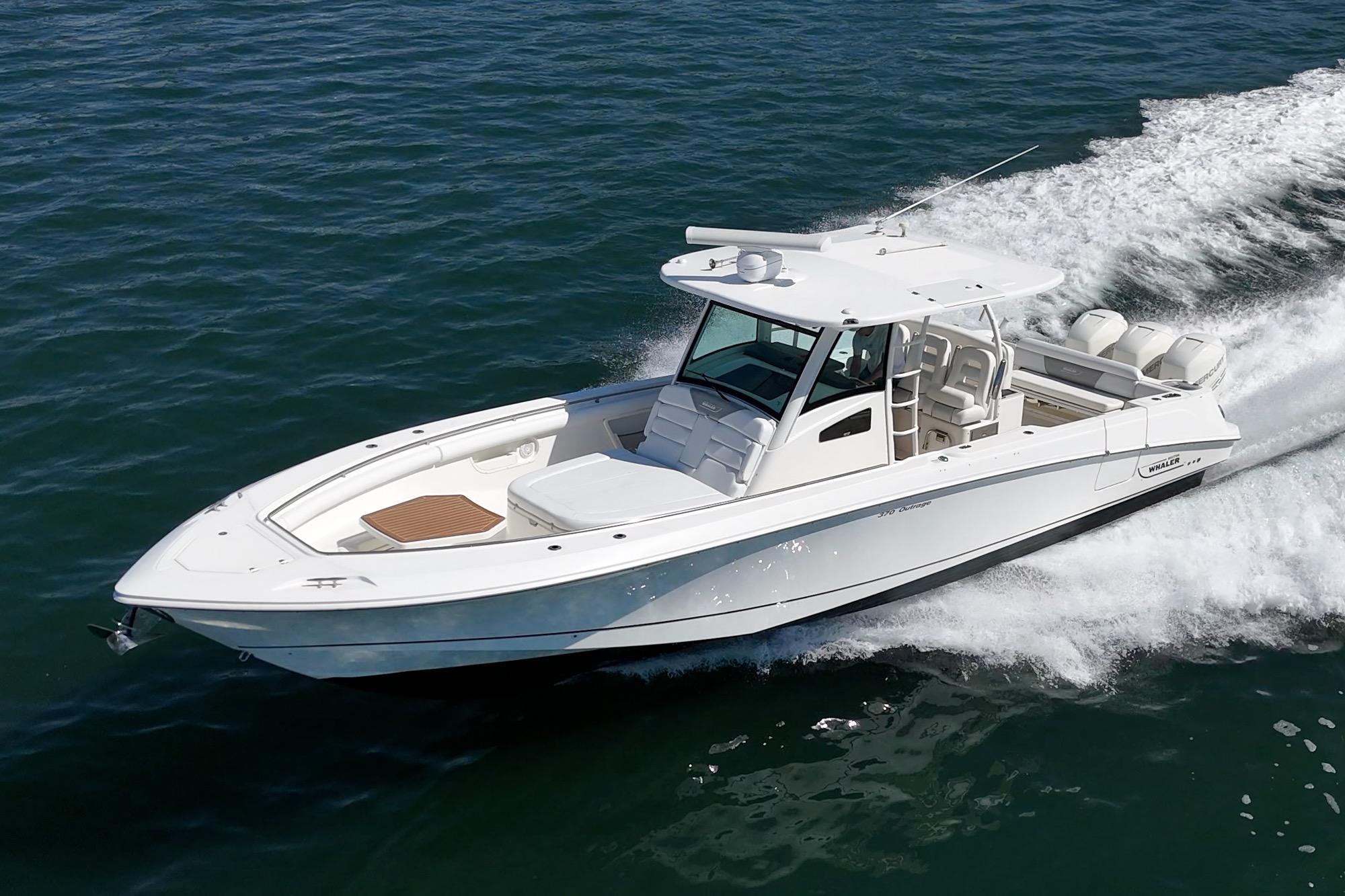 2015 Boston Whaler 370 Outrage cruising on open water, showcasing sleek design and powerful performance.