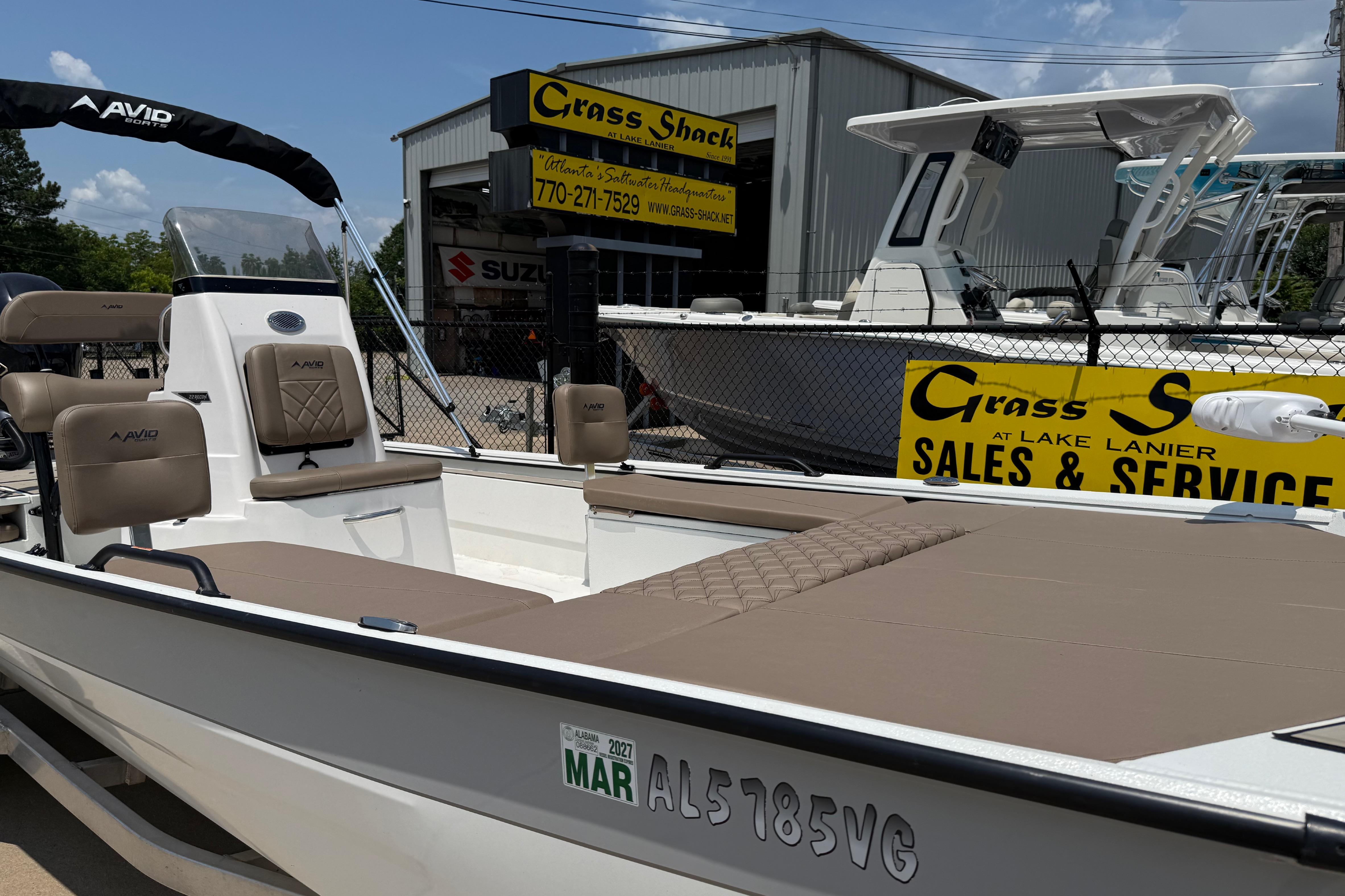 2025 Avid 22 Recon boat displayed at Grass Shack sales and service center.