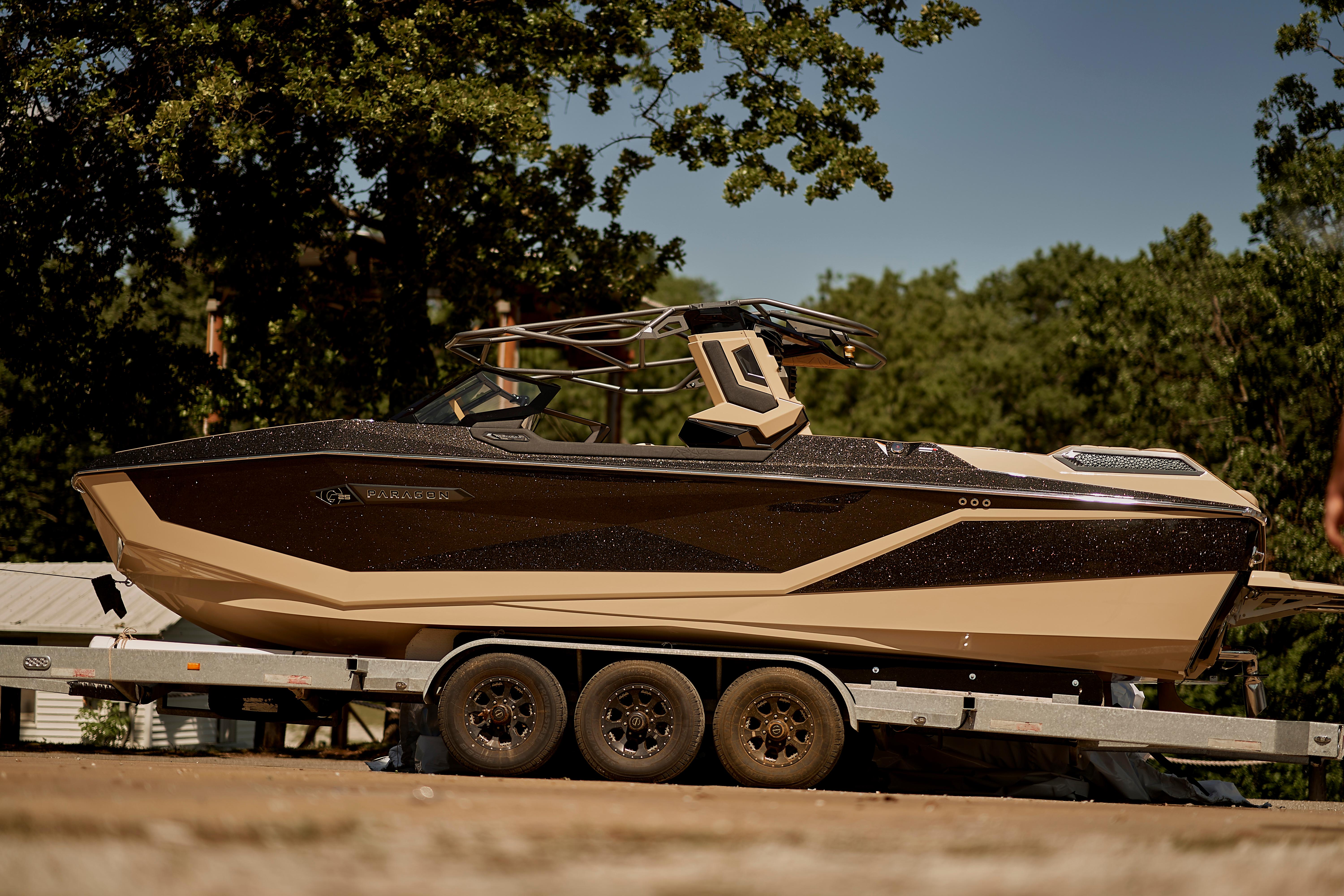 2025 Nautique Super Air Nautique G25 Paragon boat on trailer, outdoors.