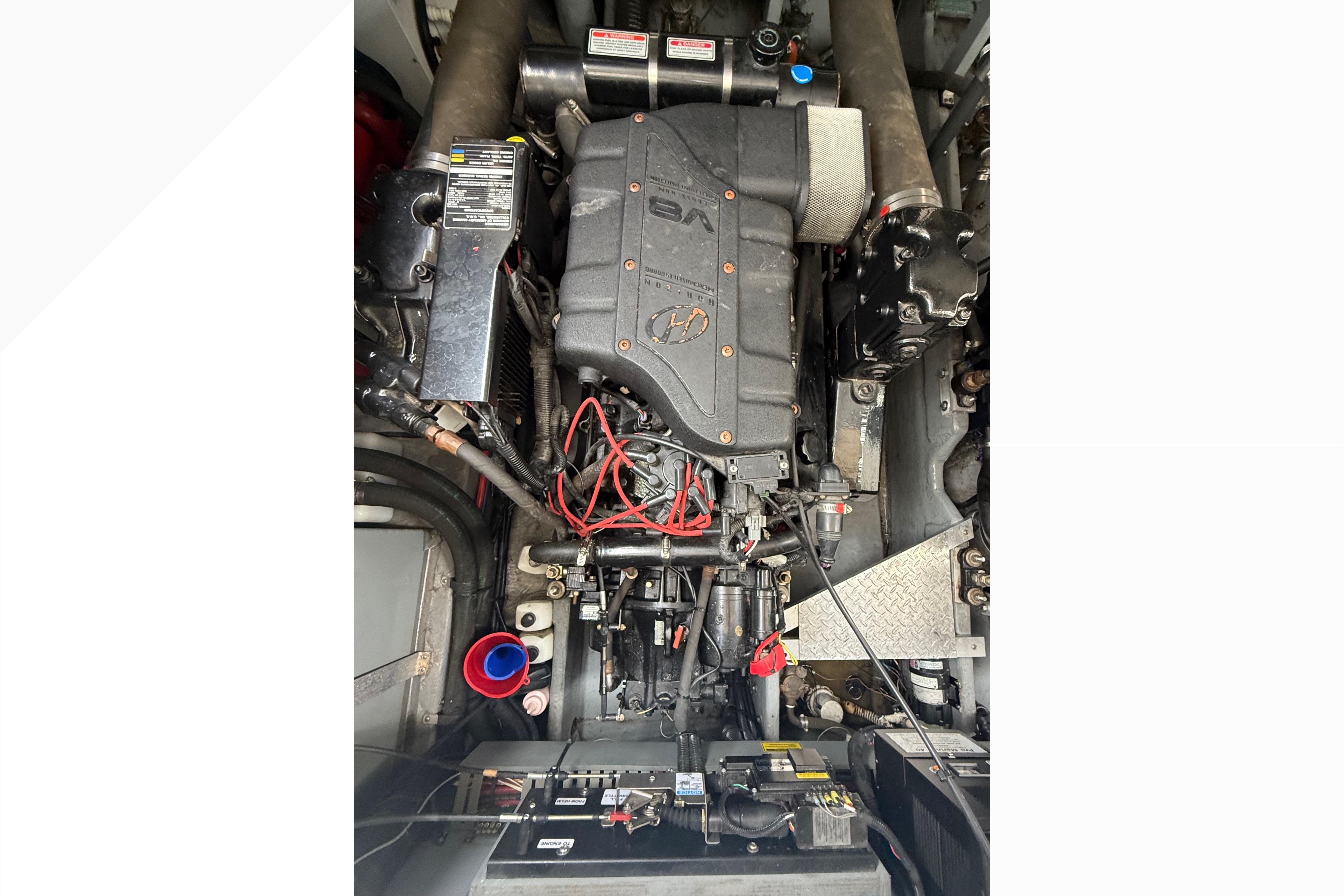 Engine compartment of a 1998 Sea Ray Sundancer 400 boat, showcasing detailed mechanical components.