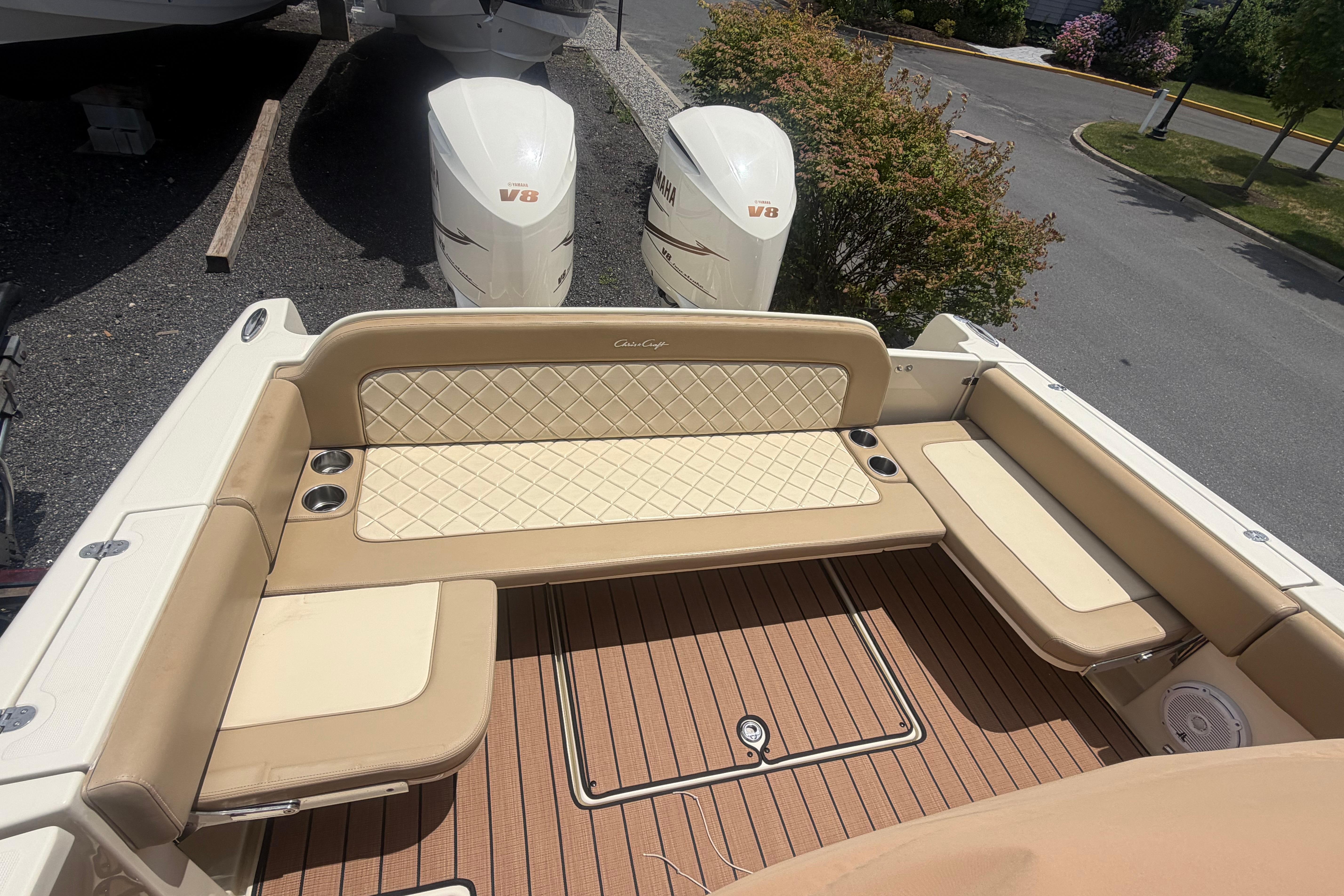 2017 Chris-Craft Catalina 34 boat with beige seating and twin V8 engines.