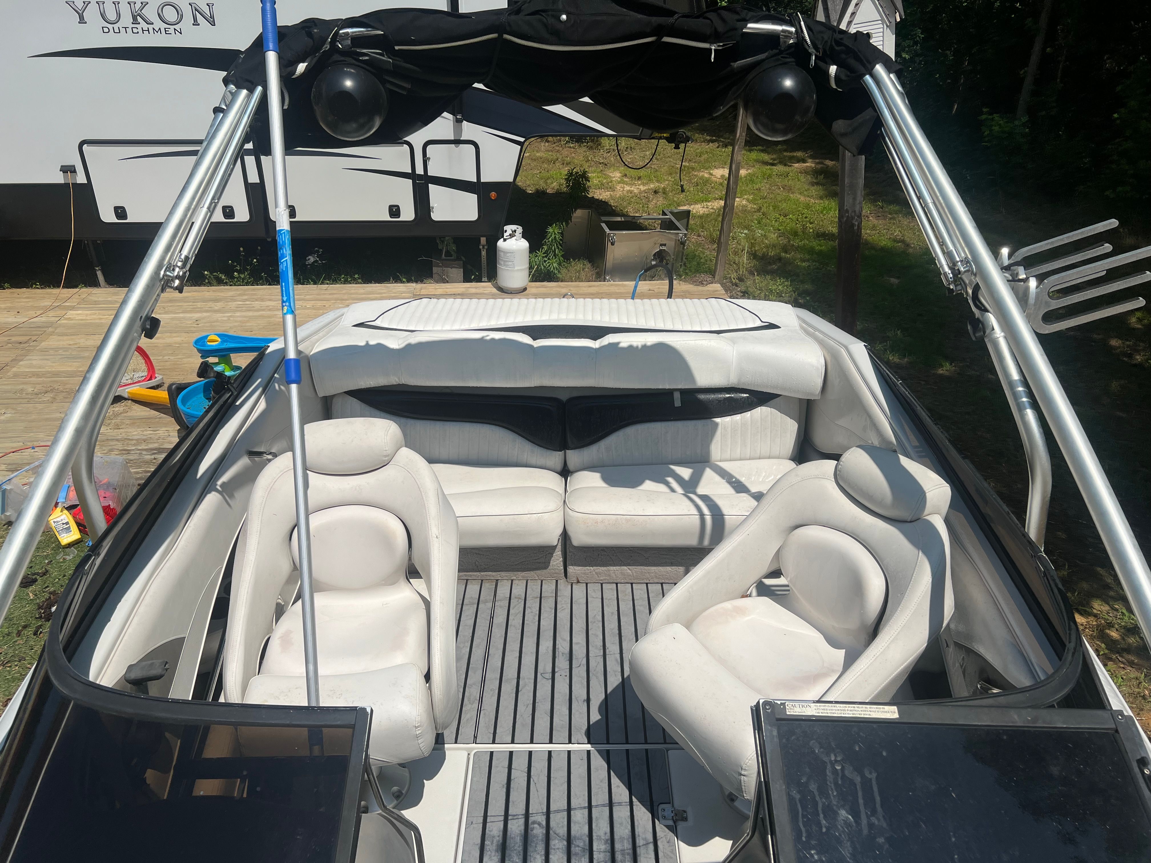 Interior of a 2001 Crownline 202 BR boat with white seating.