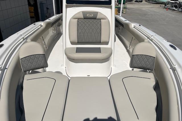 2026 Key West 239 FS boat interior with cushioned seating and sleek design.