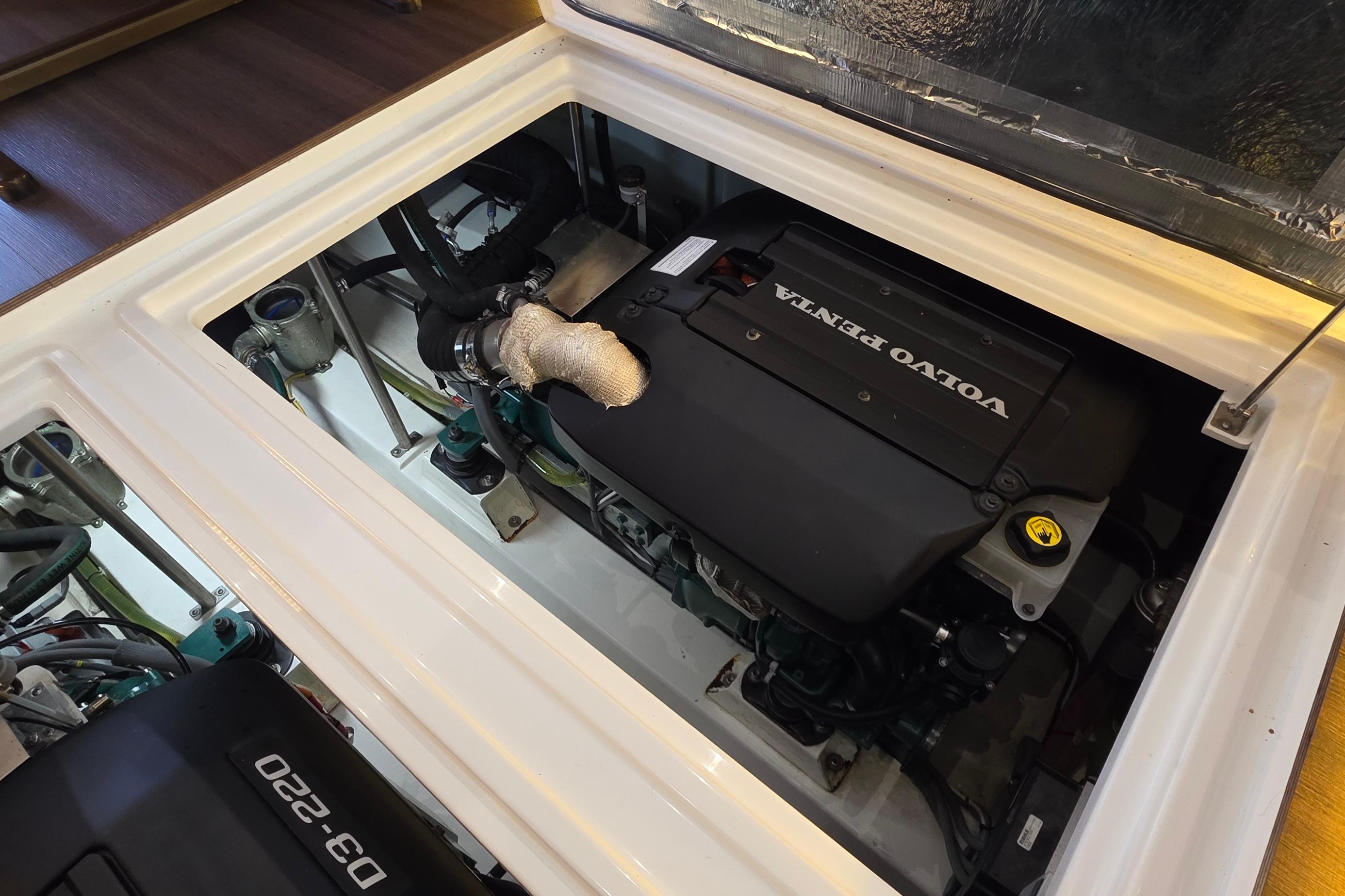 Engine compartment of 2023 Greenline 40 with Volvo Penta engine, showcasing modern marine technology.