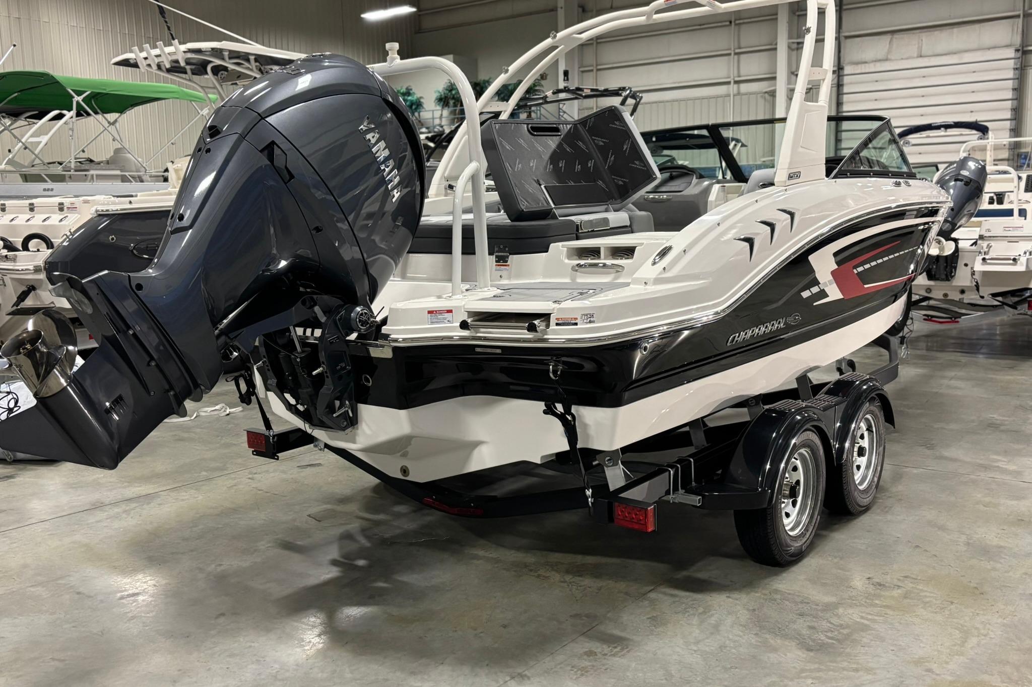 2026 Chaparral 21 SSi OB boat with Yamaha outboard motor in showroom.