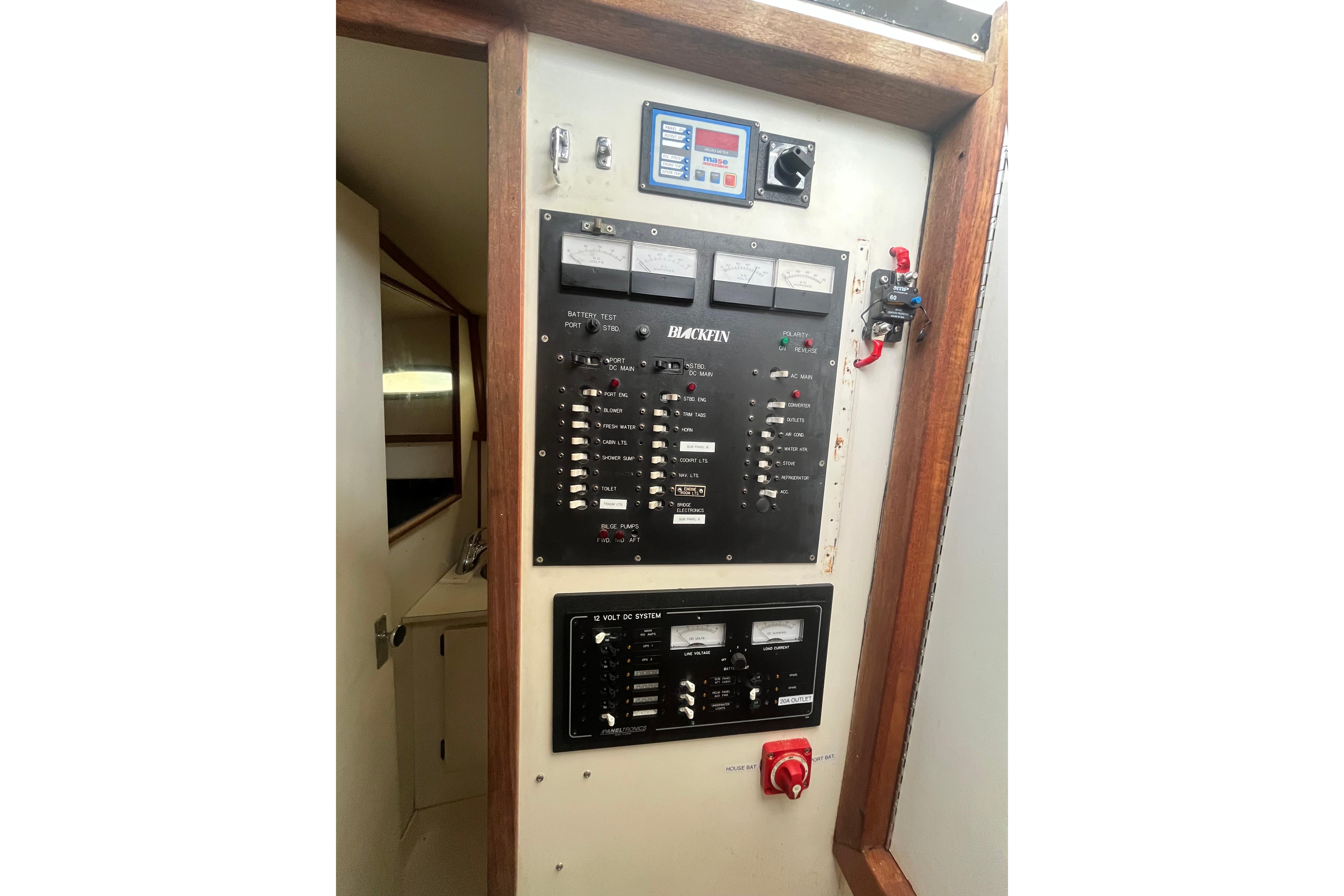 Electrical control panel on a 1989 Blackfin 31 Combi boat interior.