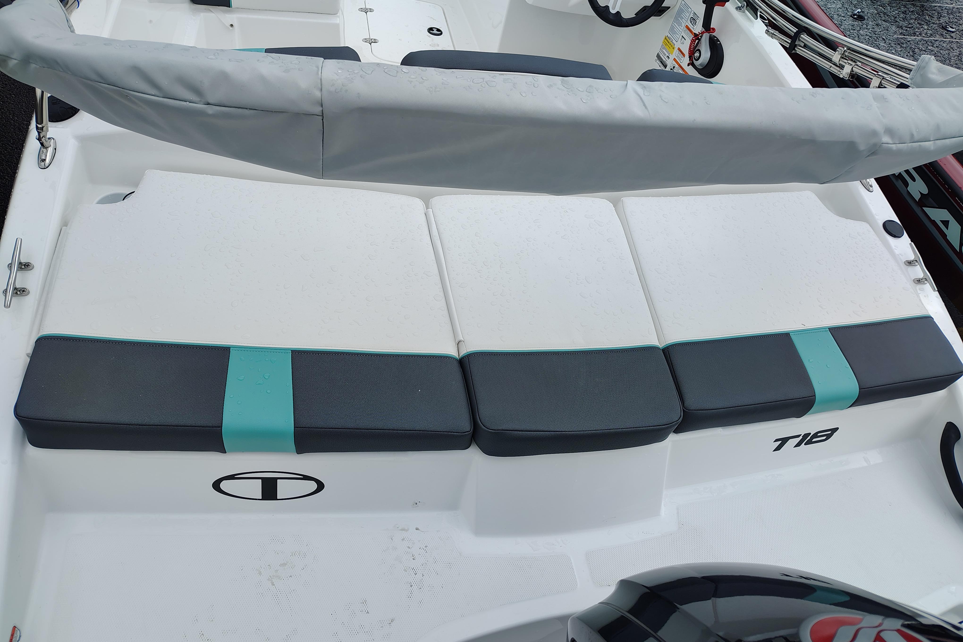 2026 Tahoe T18 boat interior with cushioned seating and steering wheel.