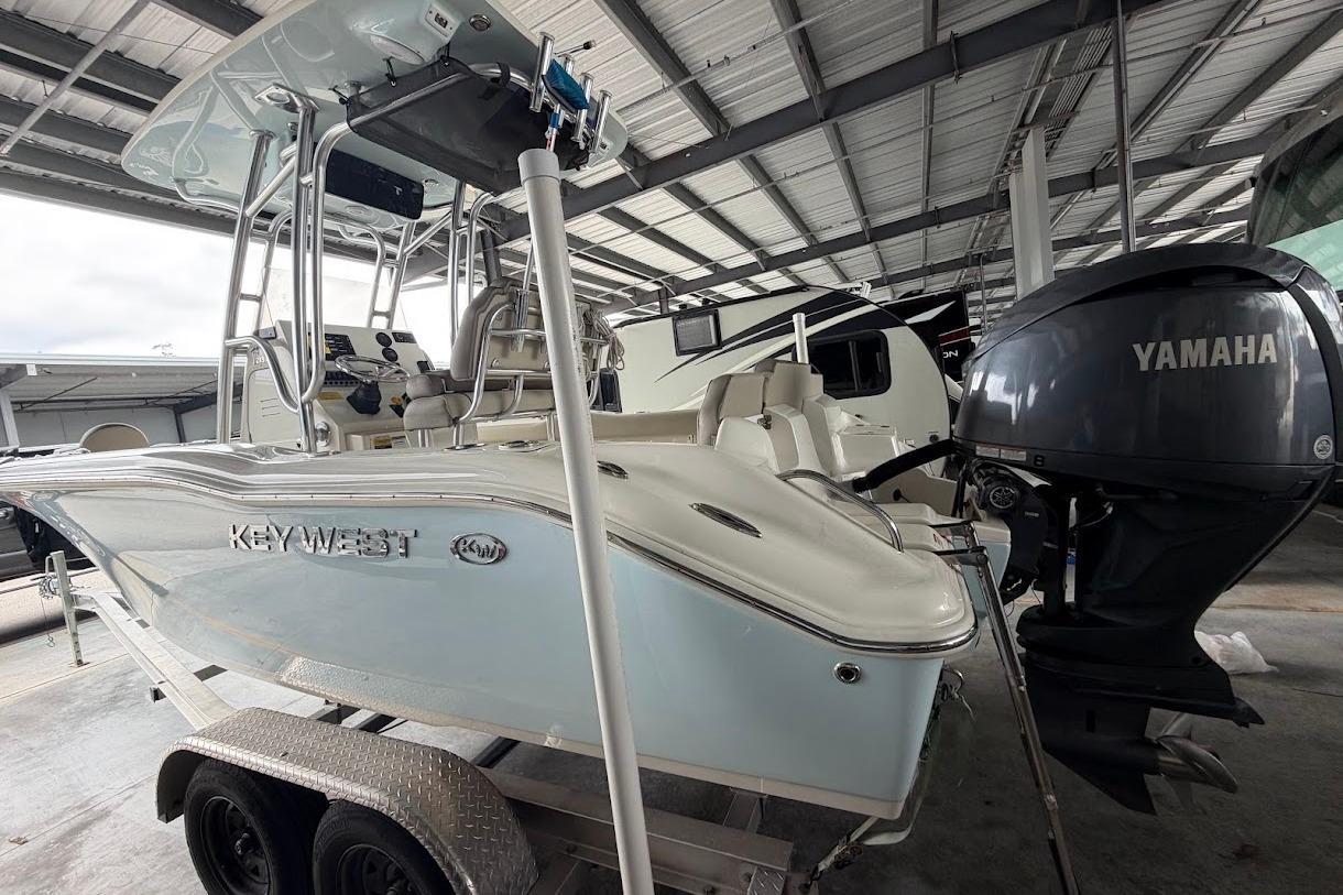 2024 Key West 219 FS boat with Yamaha engine in a covered storage area.