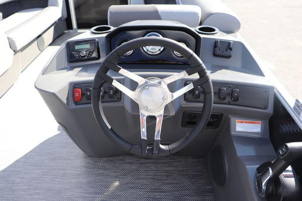 2024 Bennington 20 SL boat dashboard with steering wheel and controls.