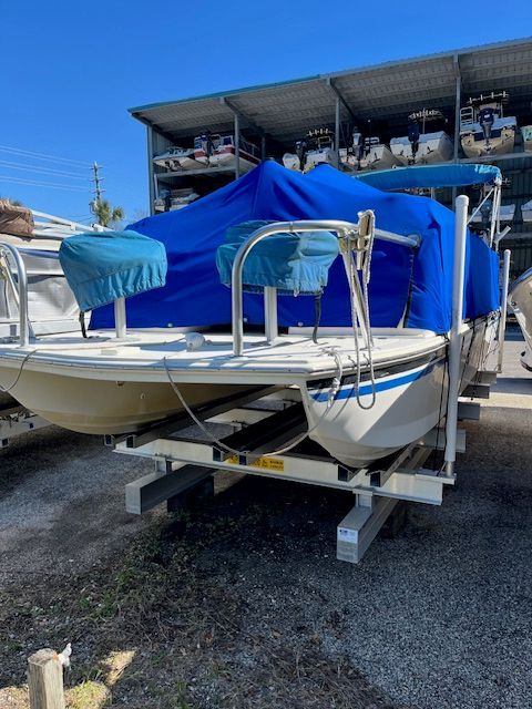 A 2017 Beachcat Catamaran with a blue cover, parked on a trailer.