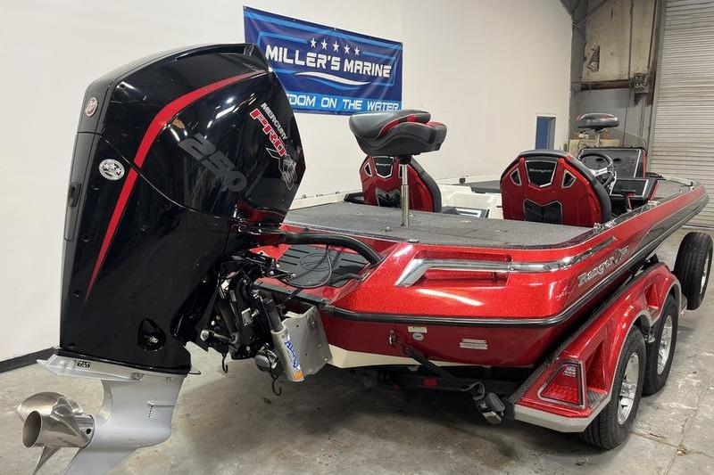 2022 Ranger Z520R bass boat in showroom, featuring powerful engine and sleek red design.