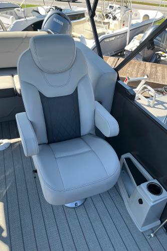 Captain's chair on 2024 Starcraft SLS 3 Q DH boat, featuring luxurious seating and cup holder.