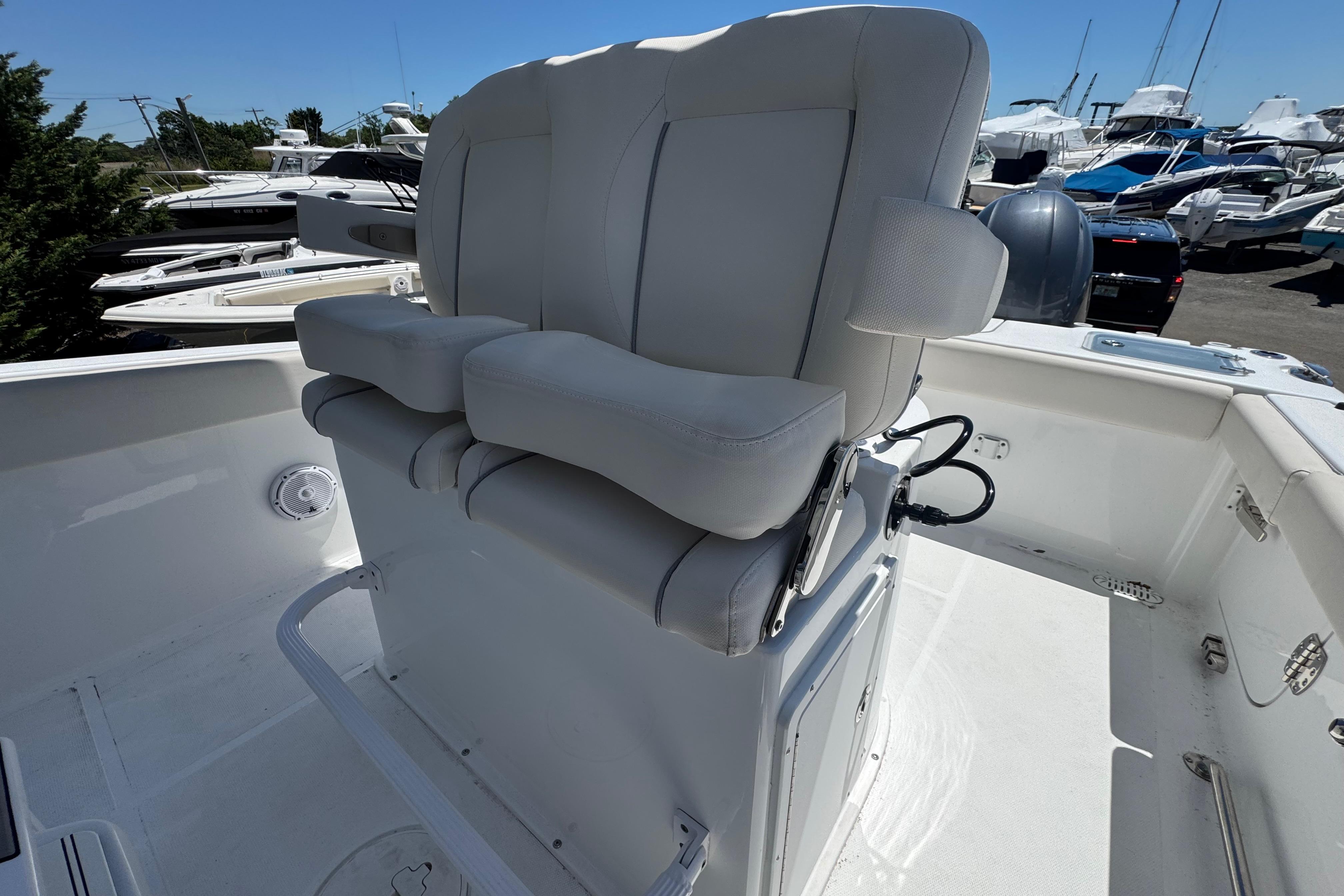2023 Sea Hunt Gamefish 25 boat with dual cushioned seats on deck.