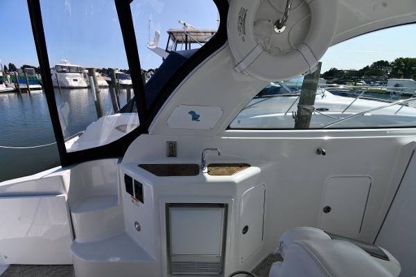 2010 Cruisers Yachts 390 Sports Coupe interior with sink and marina view.