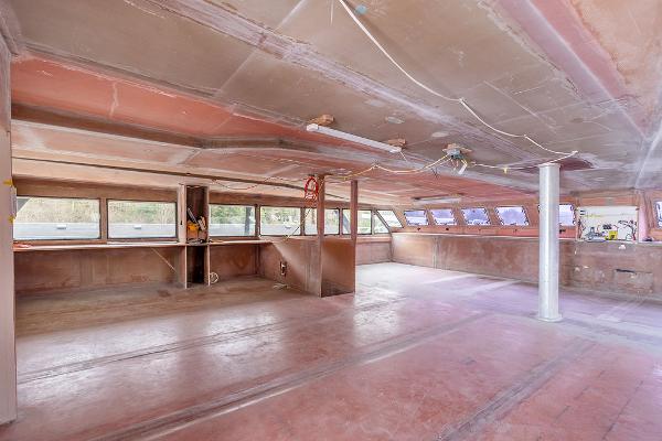 Interior of 2025 Catamaran Bloomfield 86 Motorsailor under construction, spacious and unfinished.