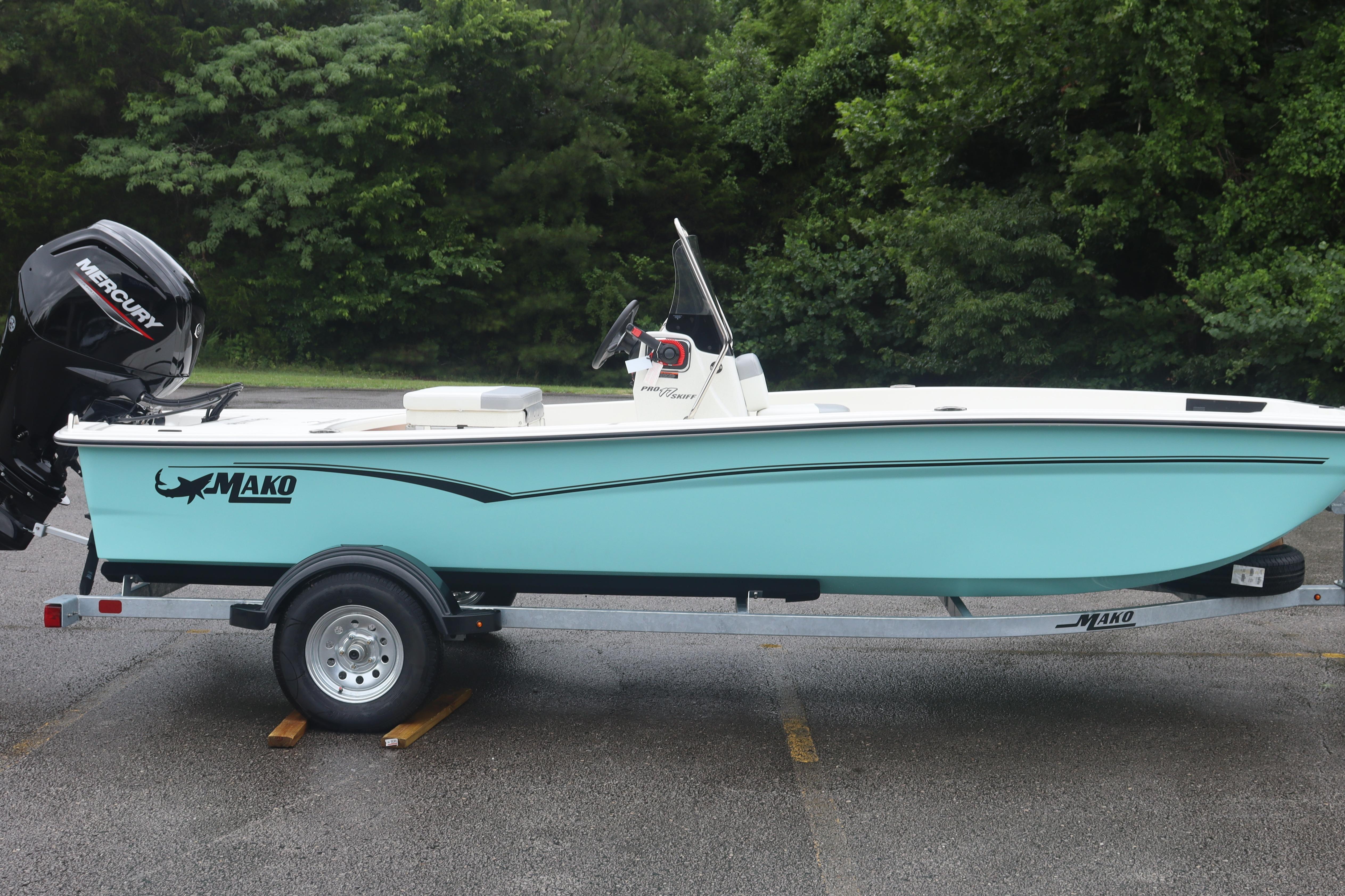 2026 Mako Pro Skiff 17 CC boat on trailer, parked outdoors.