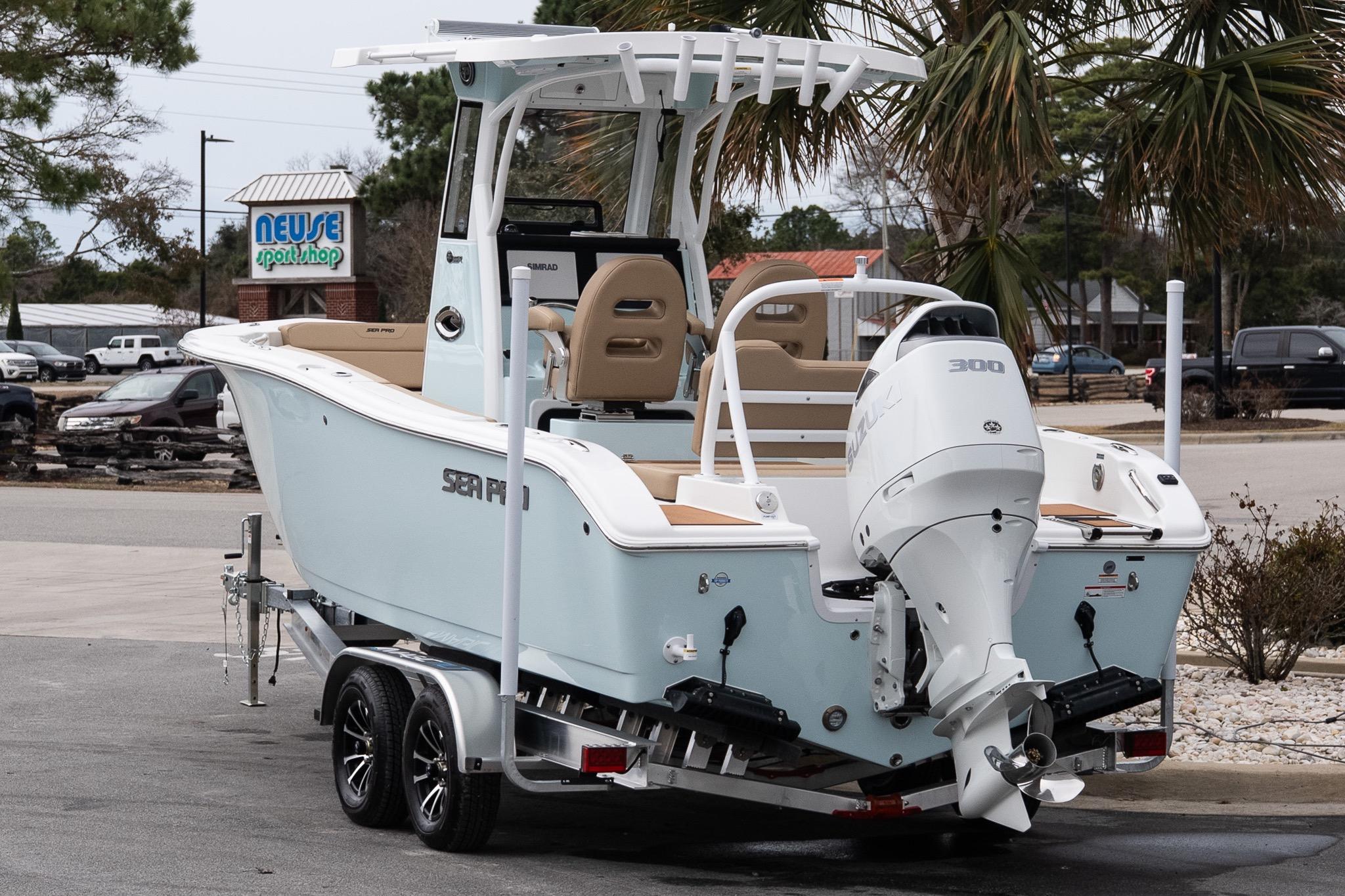 2026 Sea Pro 245FLXR Sandbar boat on trailer, parked near Neuse Sport Shop.