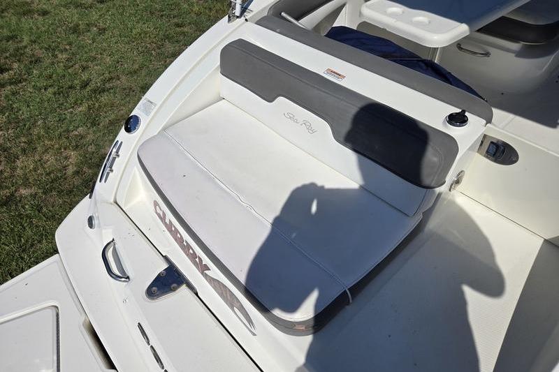 2011 Sea Ray 300 Sundeck boat interior with seating and shadow on deck.