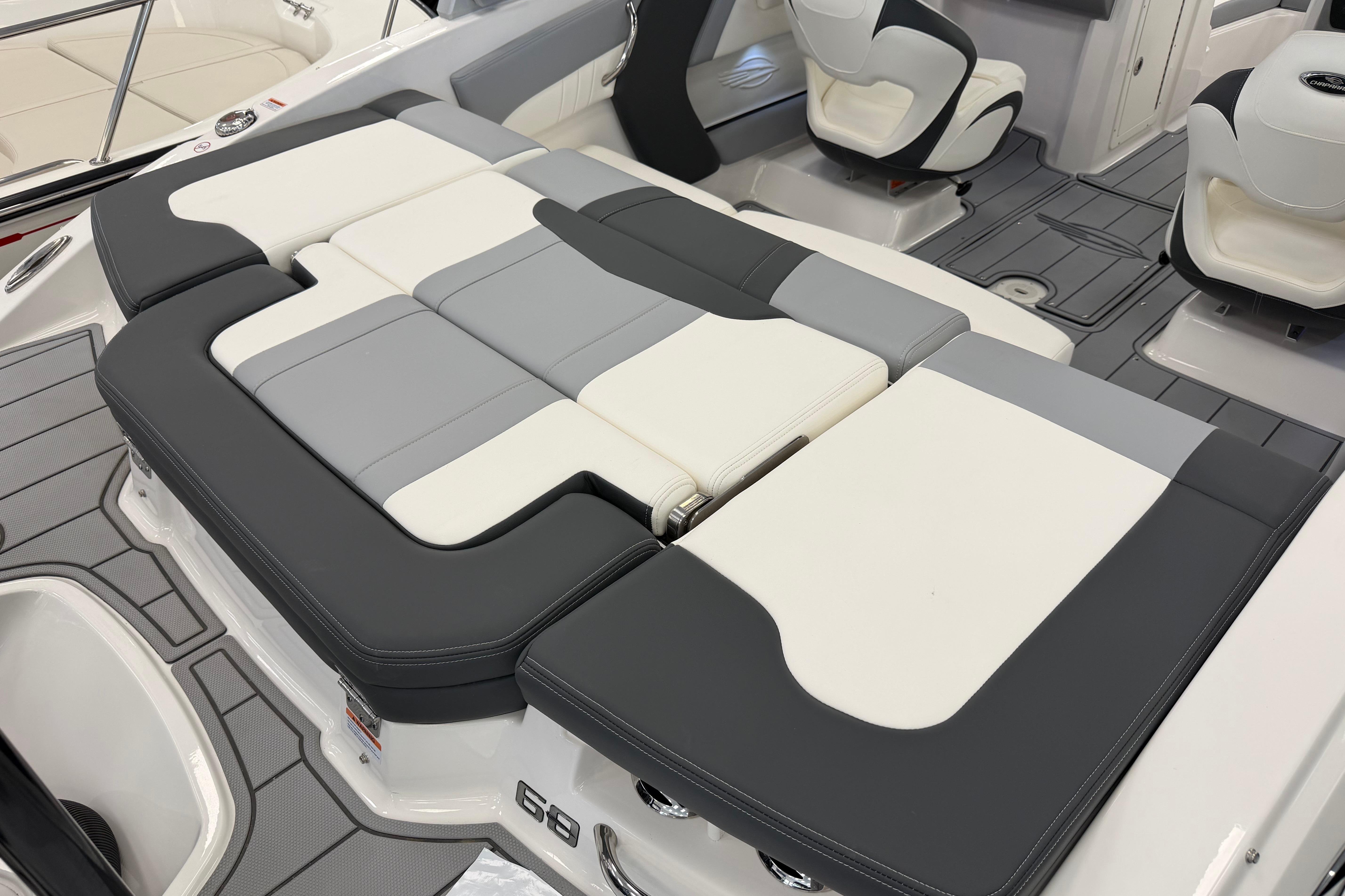 2025 Chaparral 21 SSi OB boat interior with gray and white cushioned seating.