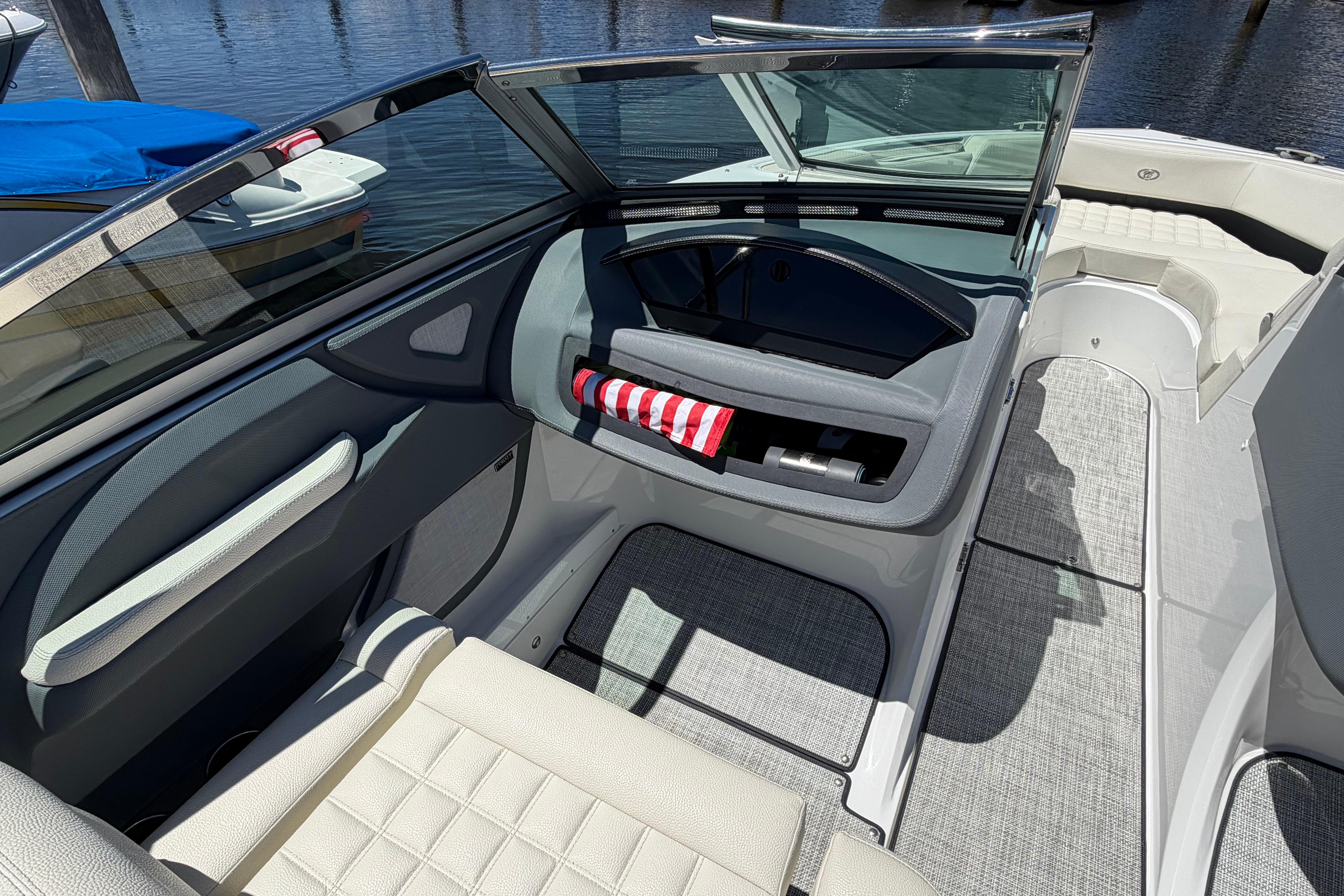 Interior of a 2020 Cobalt R3 boat with seating and storage compartments.