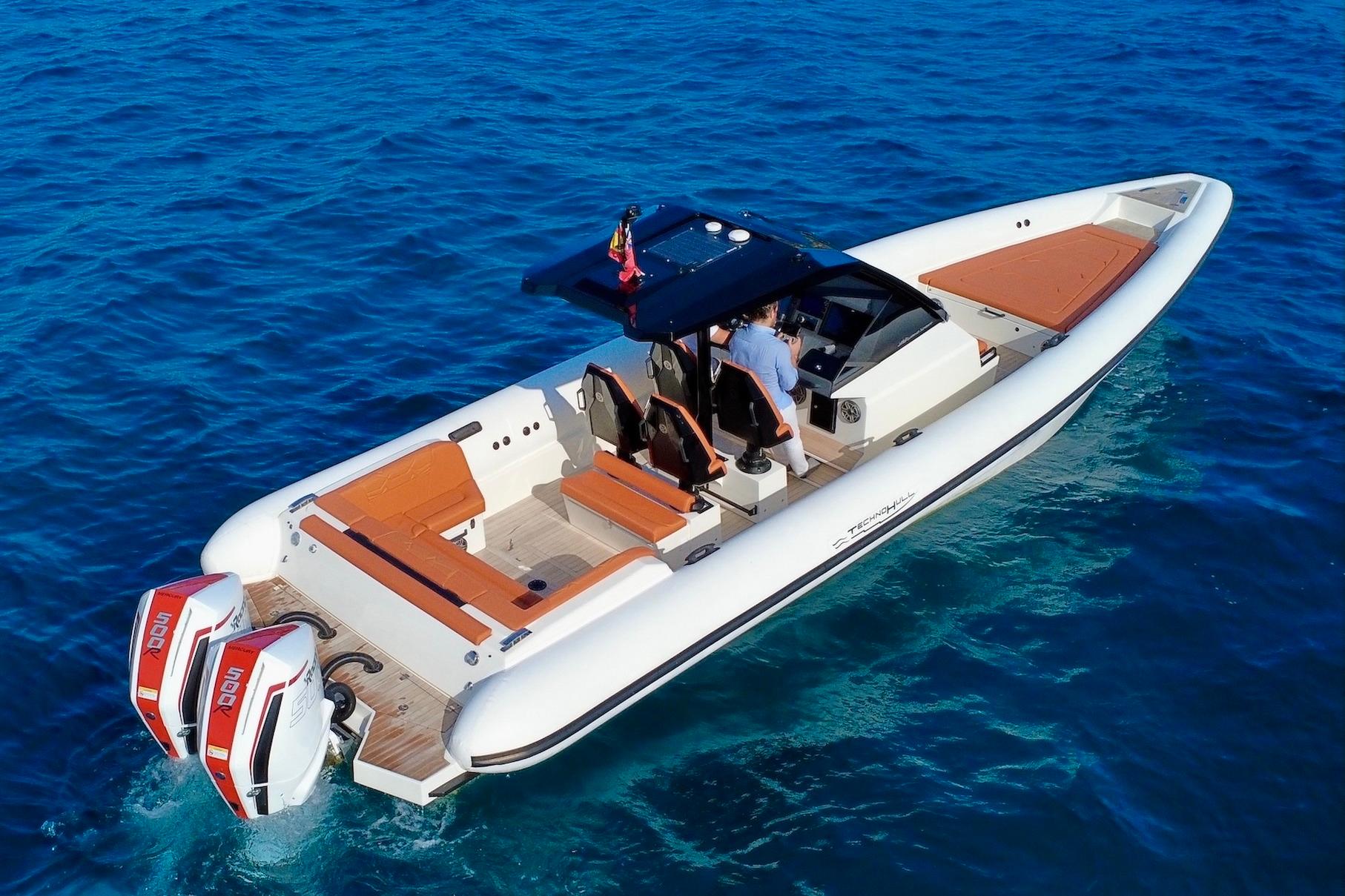 2025 Technohull 38 Grand Sport luxury speedboat cruising on clear blue water.