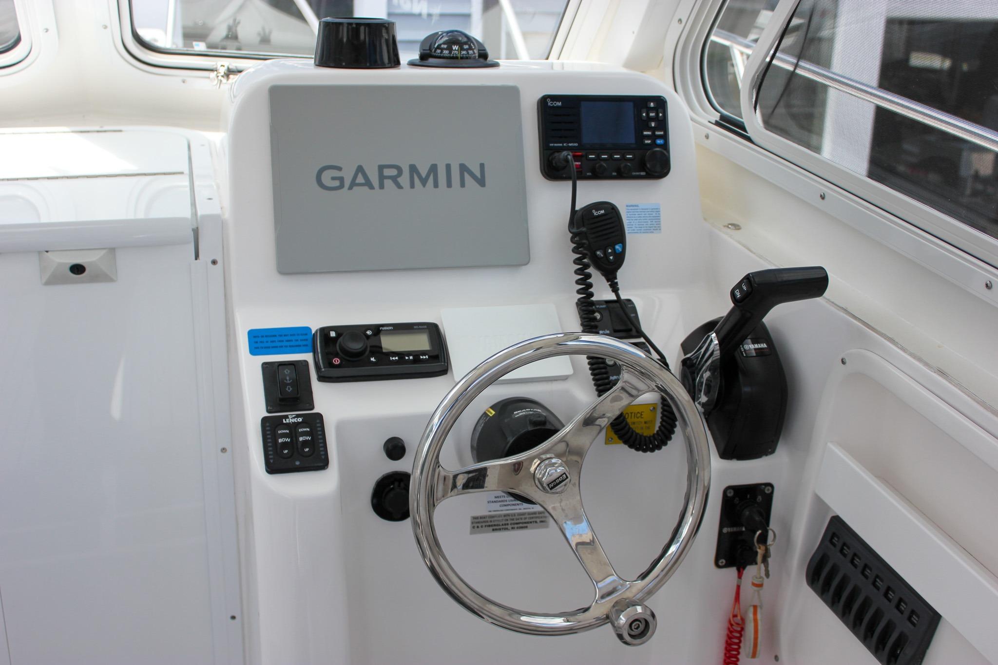 2022 NorthCoast 235 Cabin boat helm with Garmin navigation and control systems.