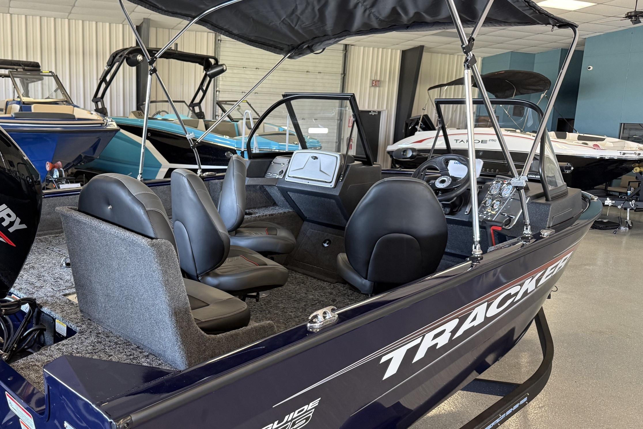 2026 Tracker Pro Guide V-175 Combo boat interior with seating and steering console.