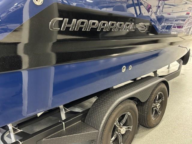 2026 Chaparral SSX 6 boat on trailer, featuring sleek blue and black design.