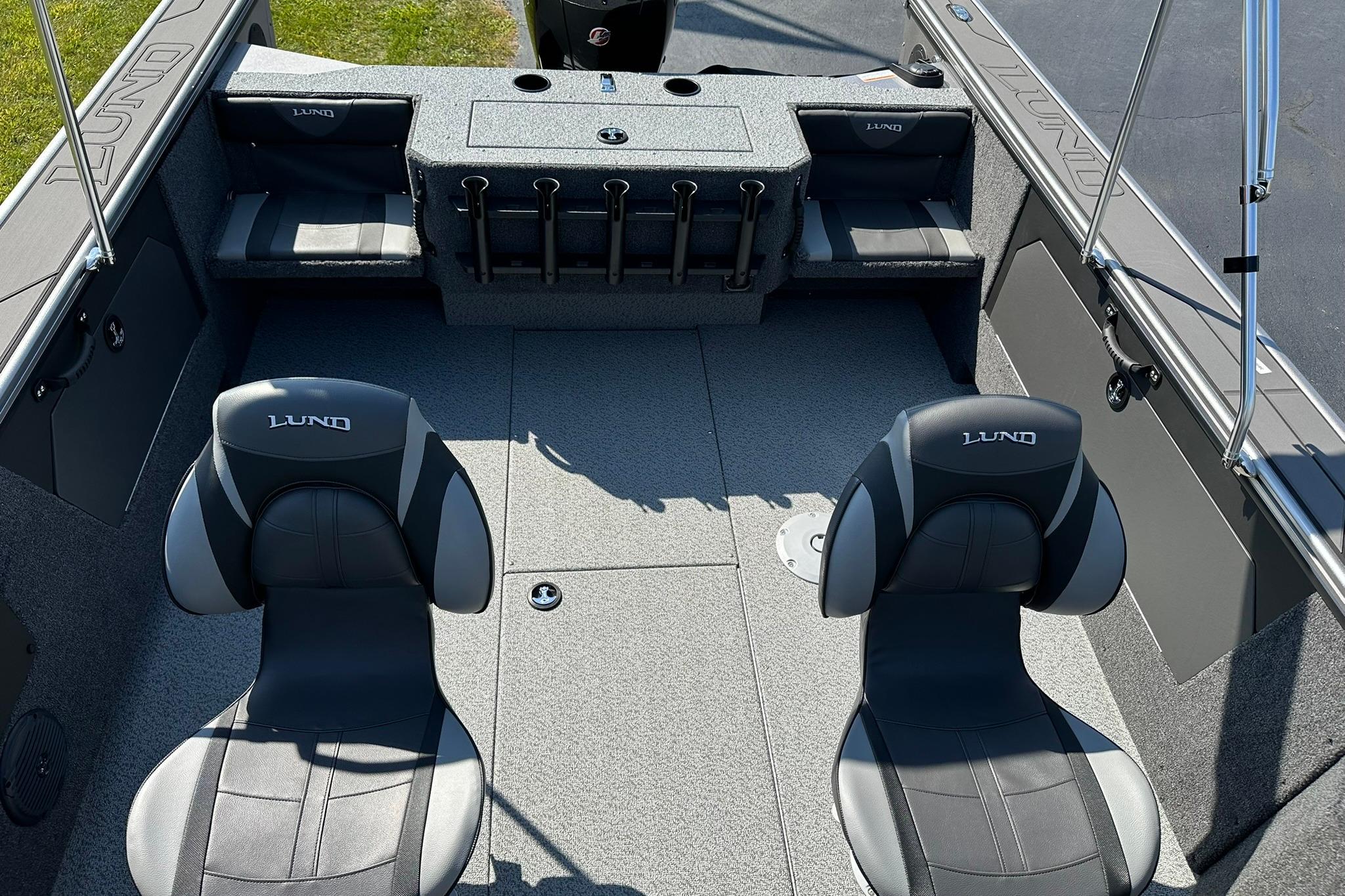2026 Lund 1875 Fisherman boat interior with seating and rod holders.