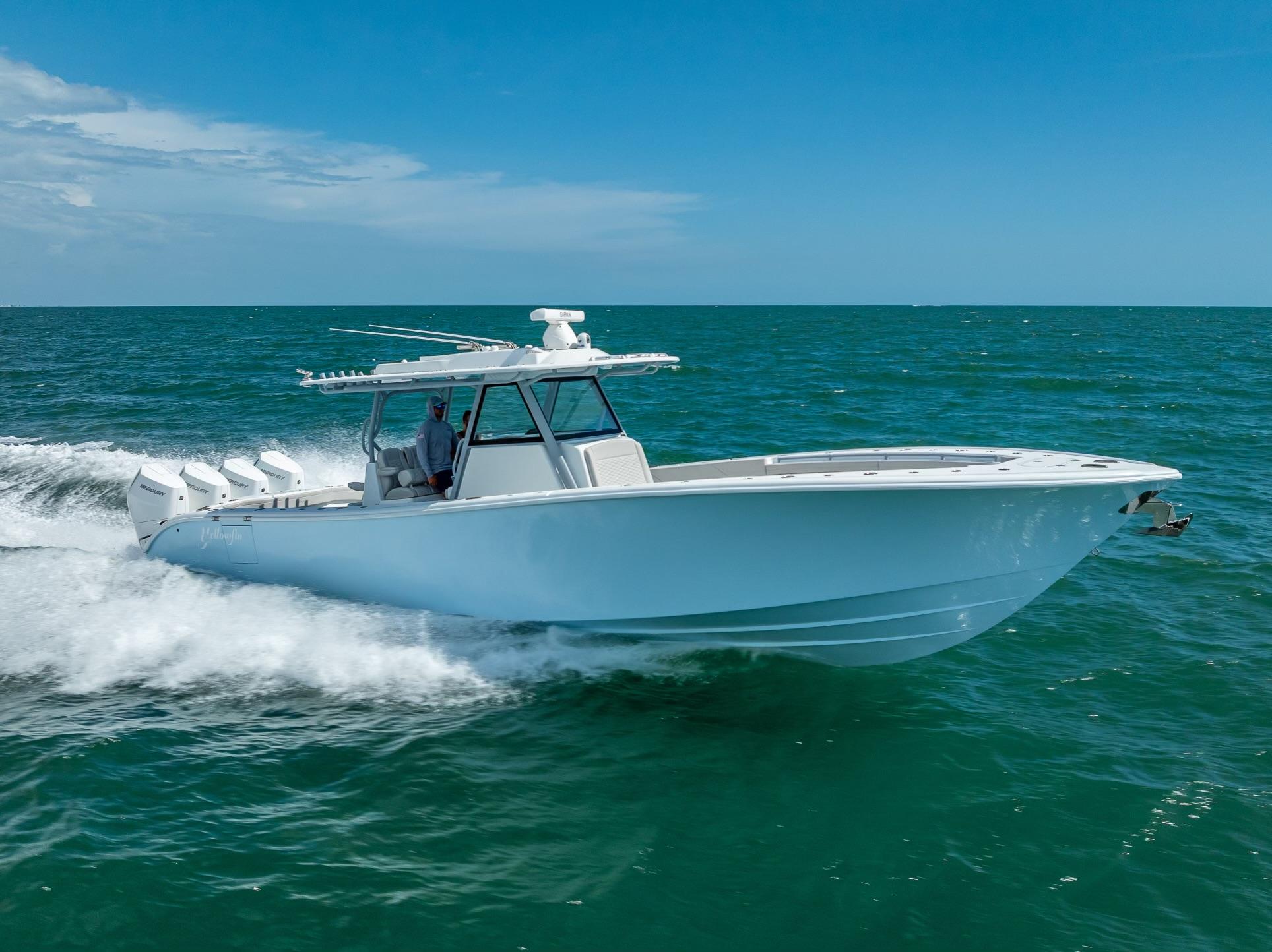 2024 Yellowfin 39 boat cruising on open ocean under clear blue sky.