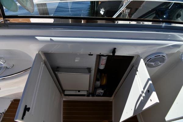 Open storage compartment on 1997 Sea Ray 400 Sundancer yacht deck.