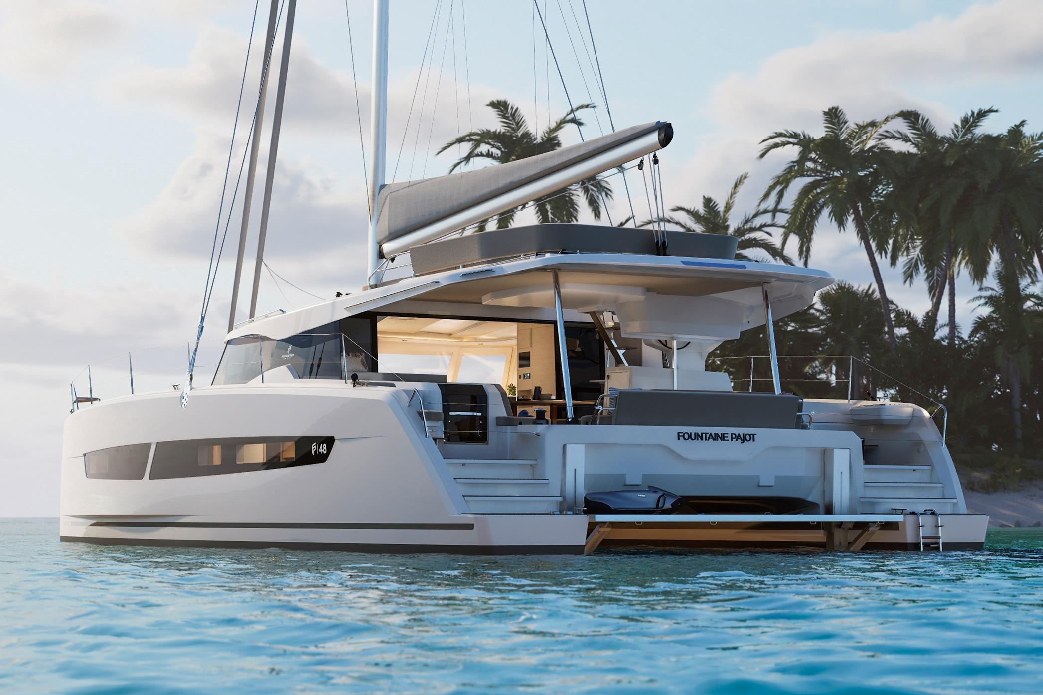 2026 Fountaine Pajot FP 48 catamaran sailing near tropical island with palm trees.