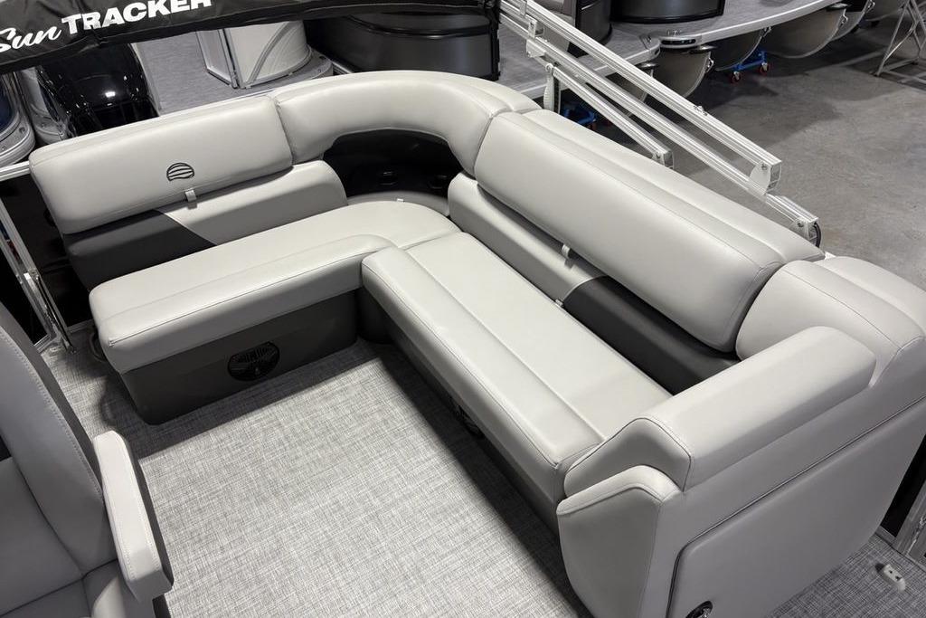 2026 Sun Tracker PARTY BARGE® 20 DLX interior with plush gray seating.