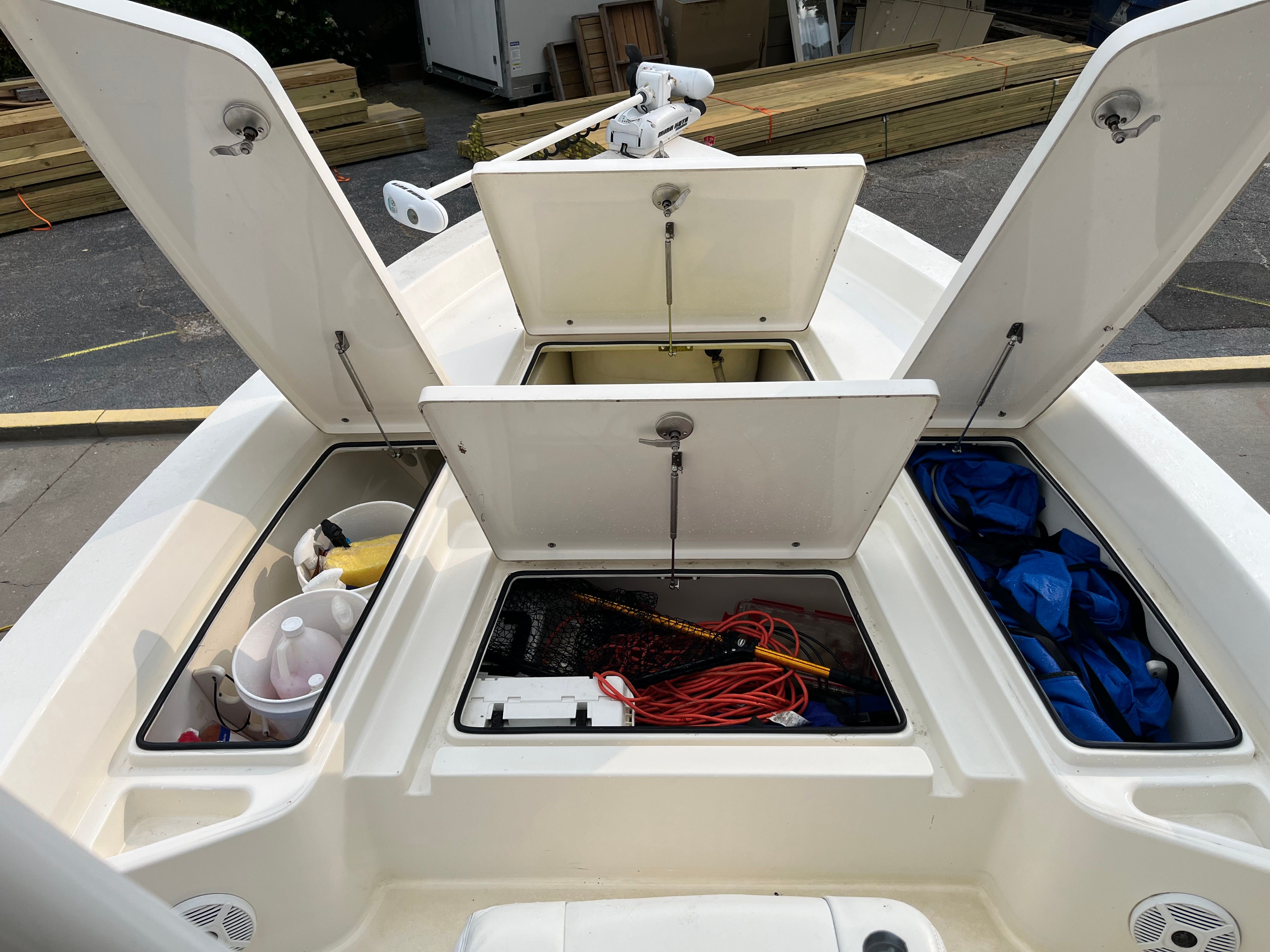 Pathfinder 2400 TRS 2016 with open storage compartments and gear.