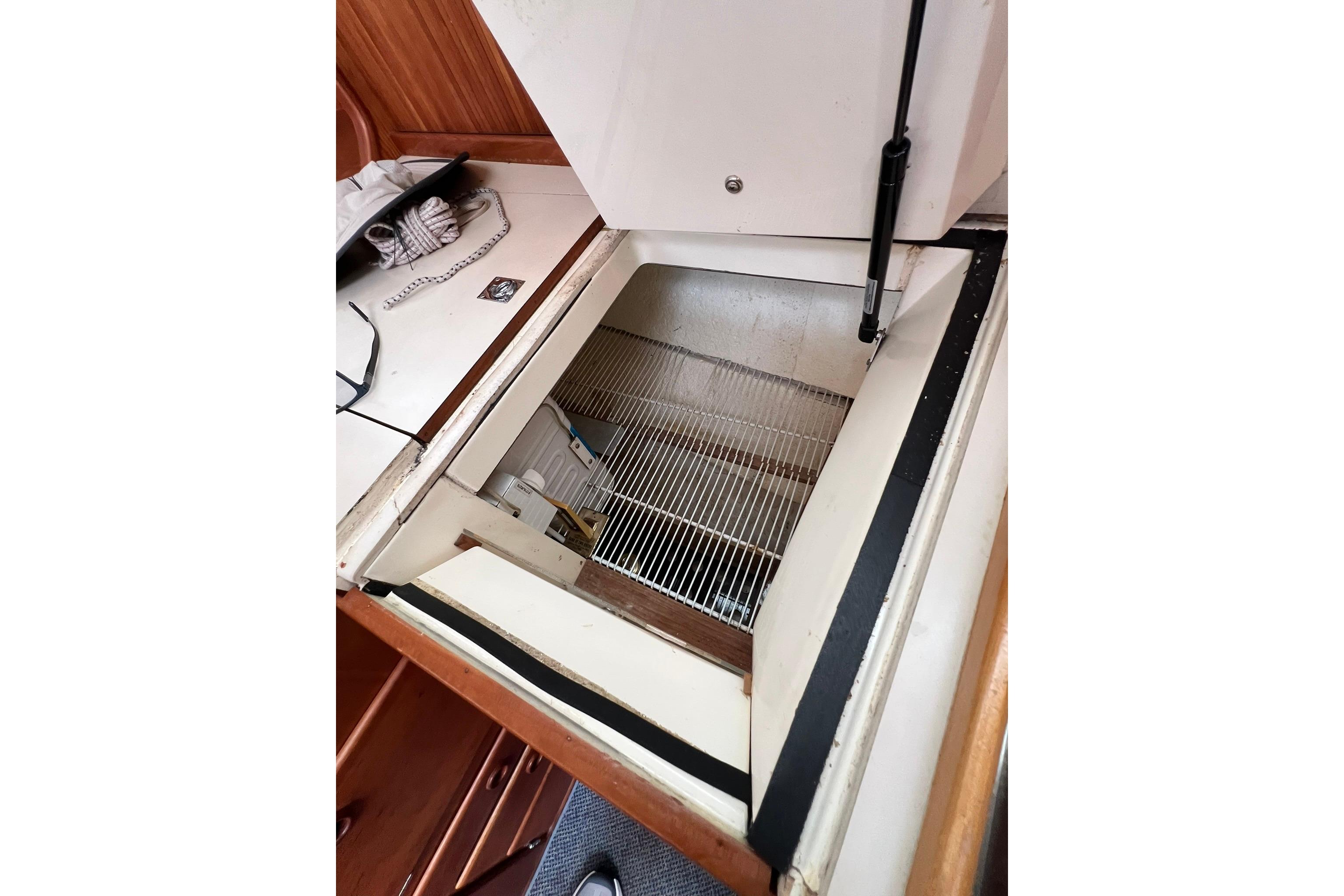 Open storage compartment in 1998 Sabre 362 yacht interior.