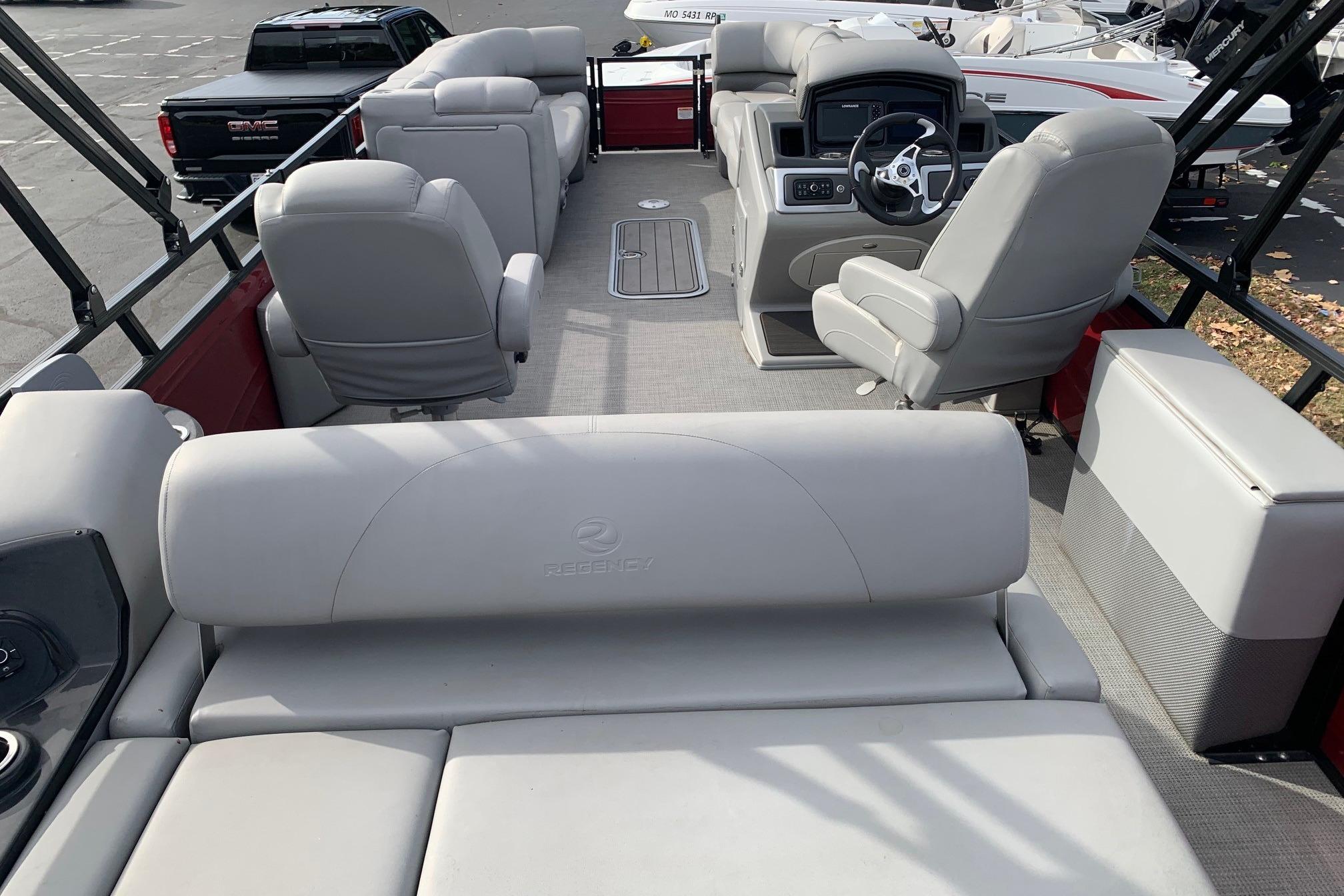 2024 Regency 250DL3 pontoon boat interior with plush seating and modern dashboard.