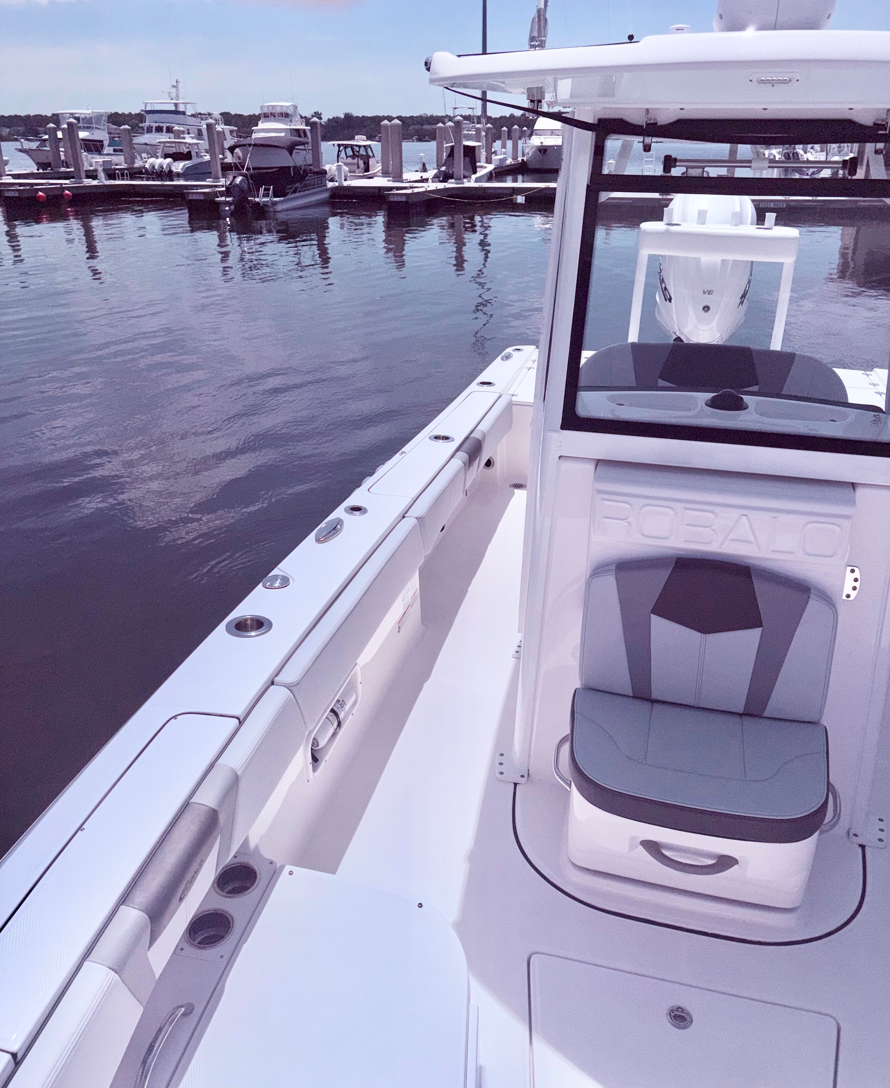 2025 Robalo 266 Cayman boat docked at marina.