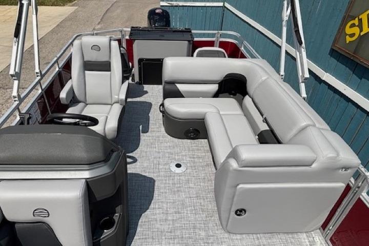 2026 Sun Tracker SportFish 20 DLX pontoon boat with gray seating and modern interior design.
