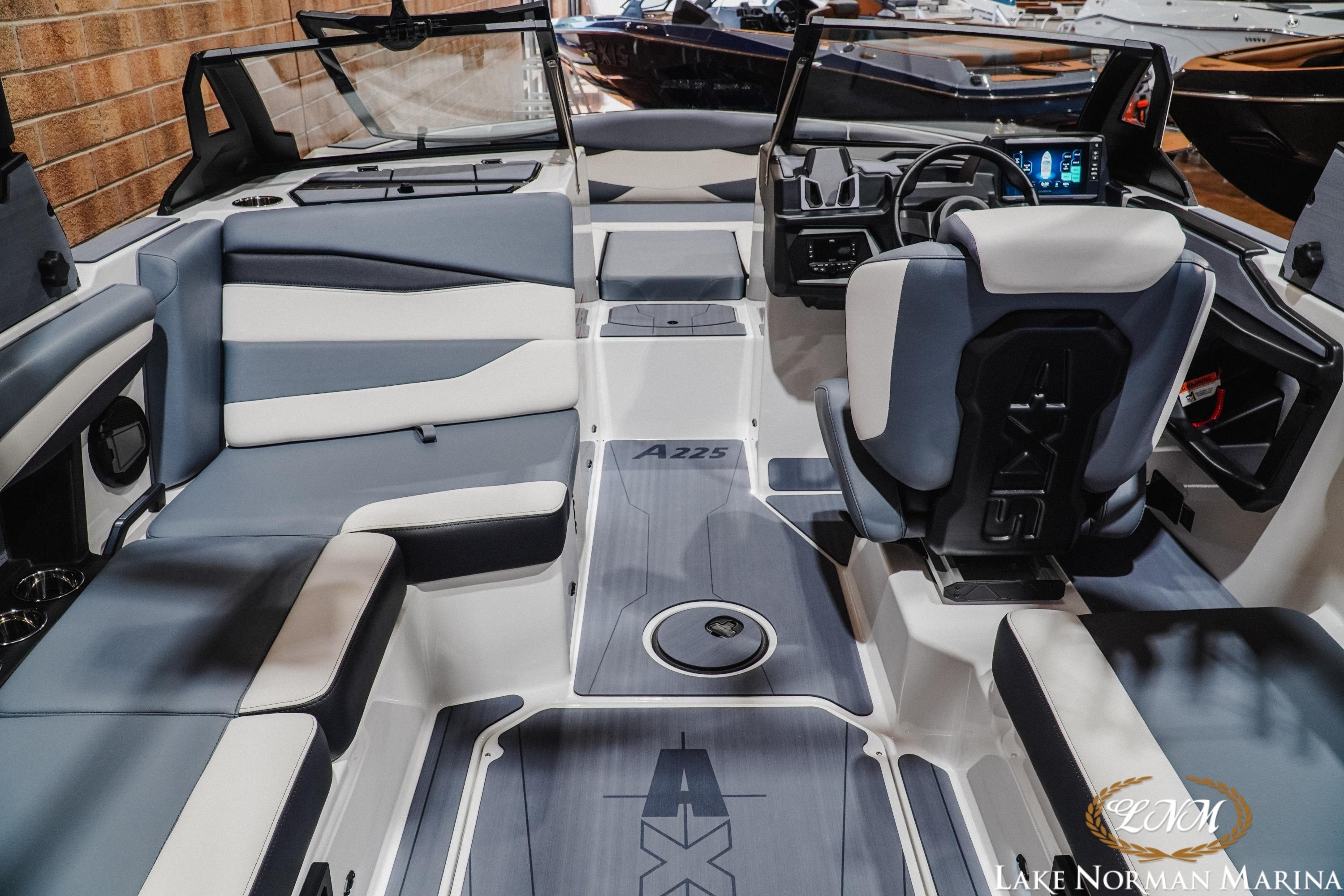 Interior of 2026 Axis A225 boat with modern seating and dashboard design.