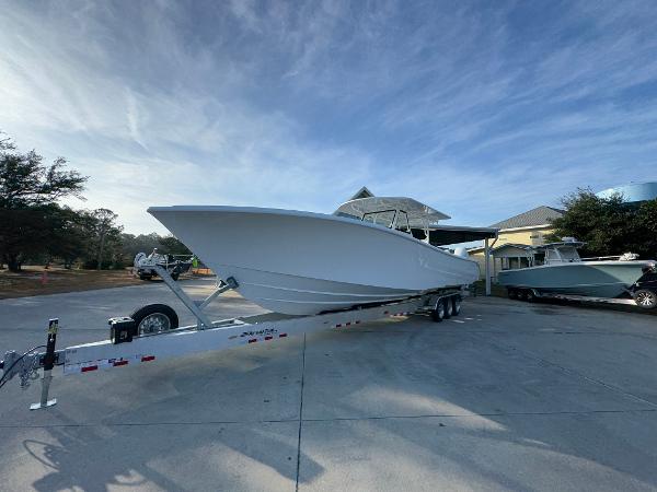 2025 Yellowfin 39 Offshore boat on trailer, parked outdoors under a clear sky.