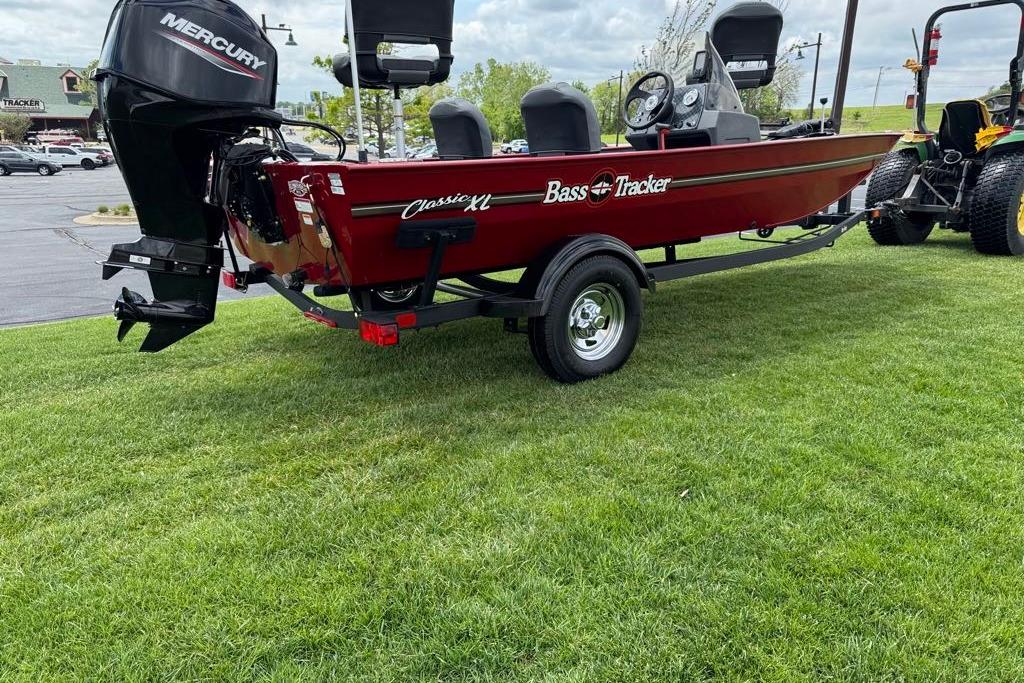 2026 Tracker Bass Tracker Classic XL boat on trailer, parked on grass.