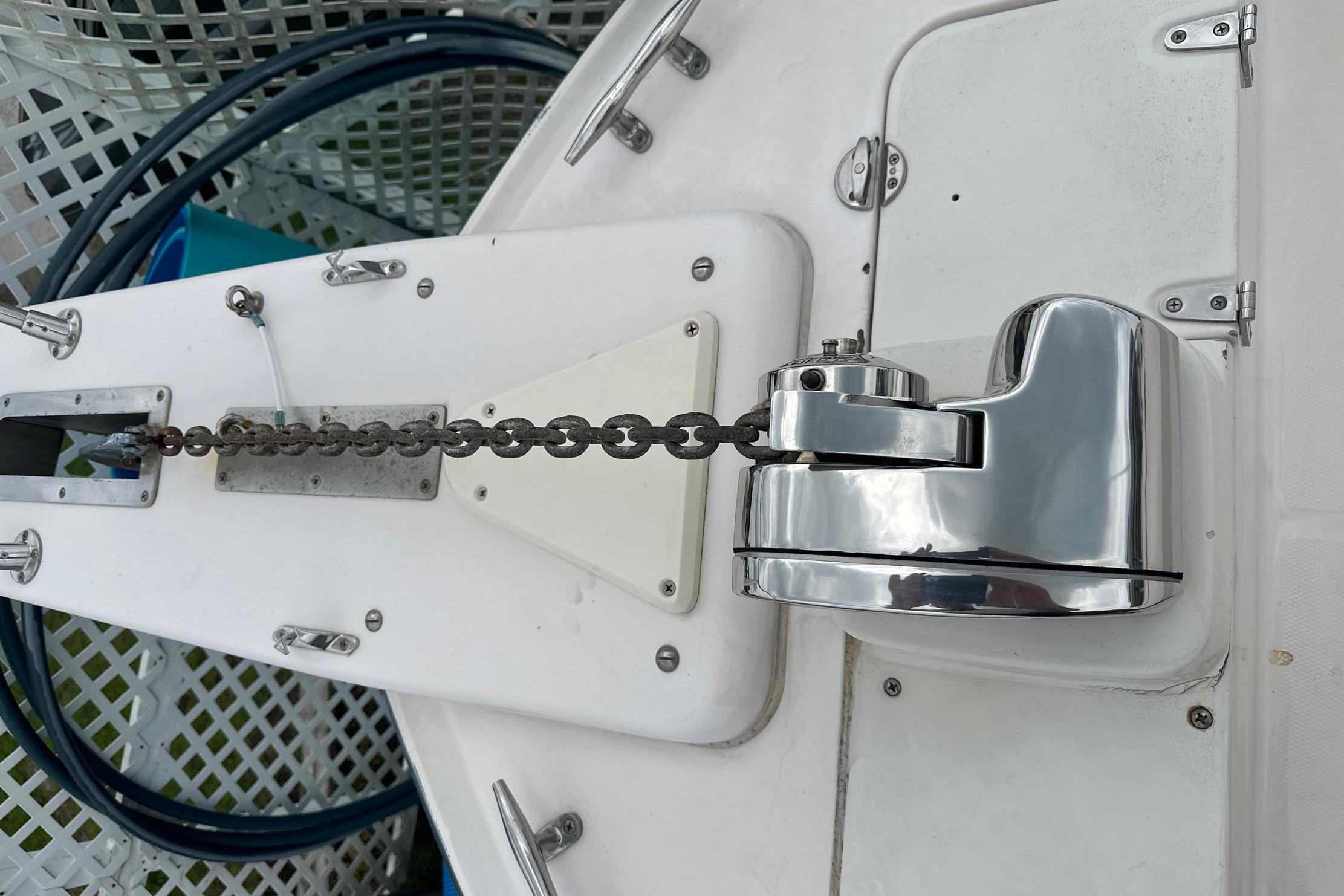 Anchor chain and windlass on a 2006 Grady-White Marlin 300 boat deck.