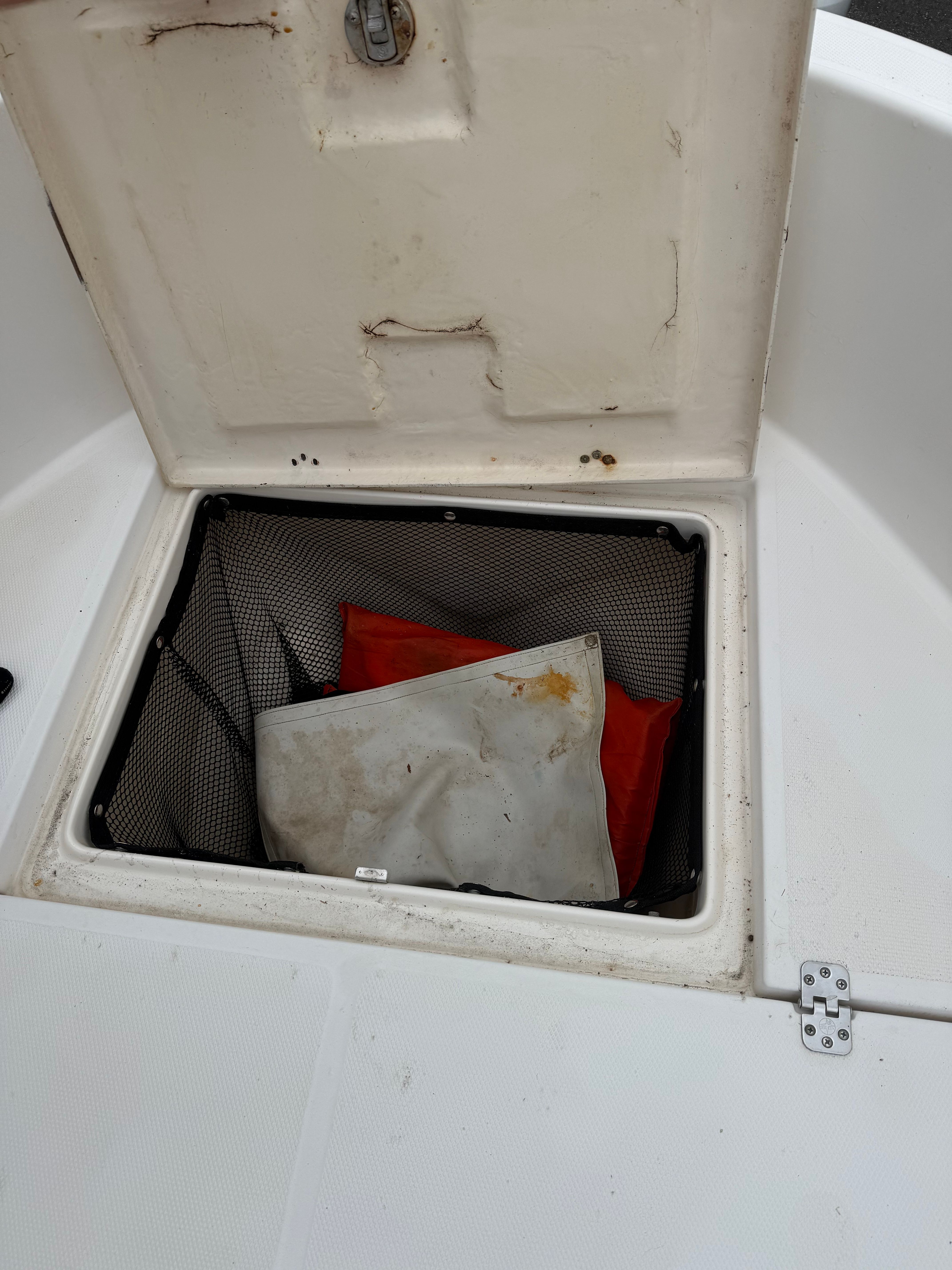 Storage compartment in Wellcraft 212 Fisherman boat, year 2005.