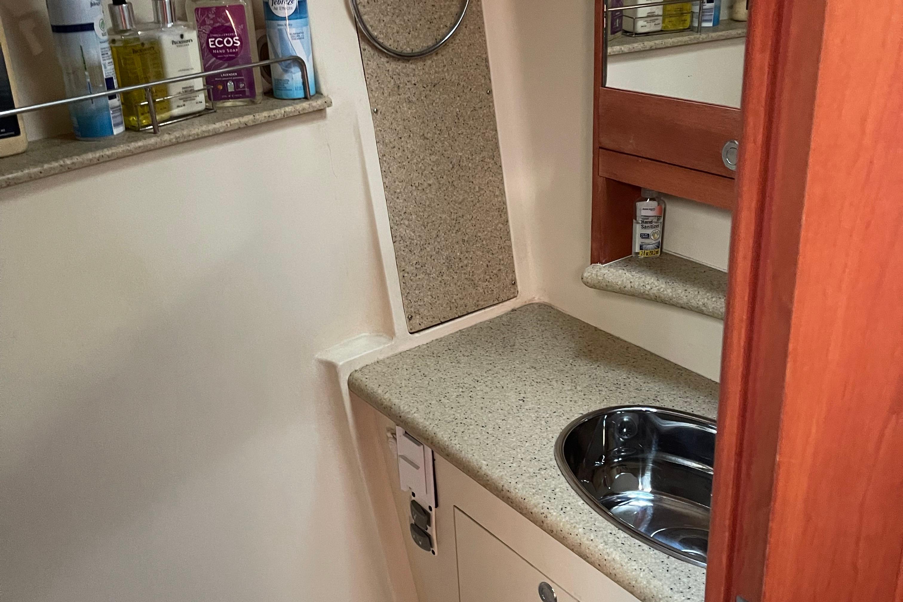 Bathroom interior of 2008 Hunter 49 yacht with sink and toiletries.