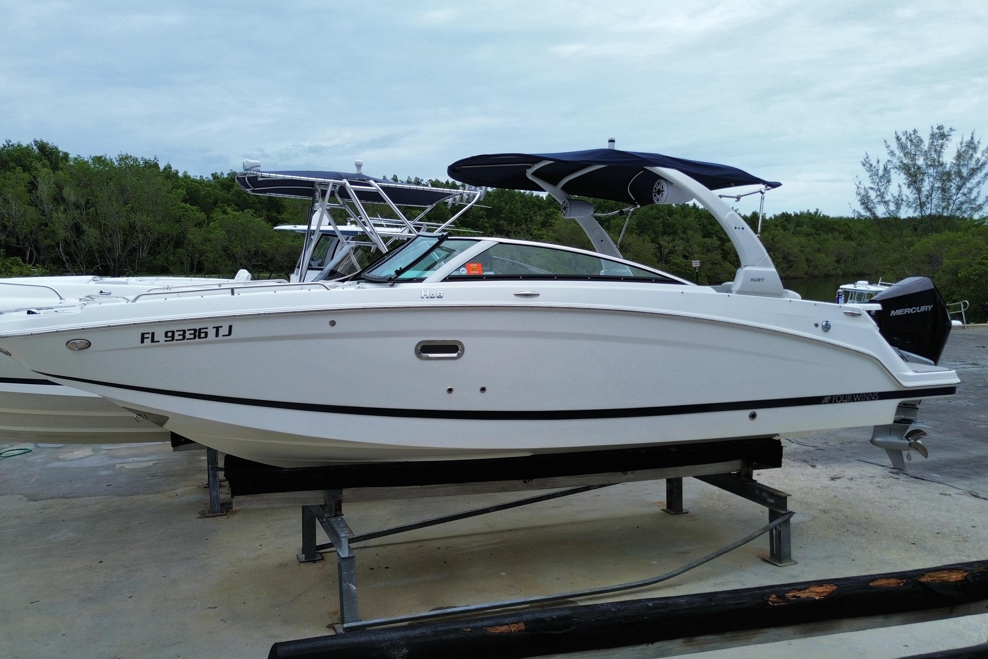 2022 Four Winns HD8 OB boat on display, featuring sleek design and Mercury outboard engine.