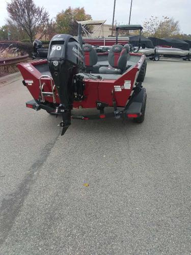 2024 Ranger VS1665T boat with outboard motor, parked on a trailer in a lot.