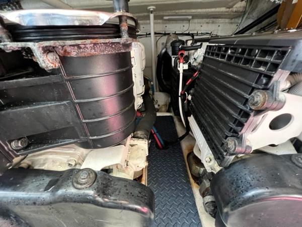 Engine compartment of a 2009 Ovation 52 boat with visible components and machinery.